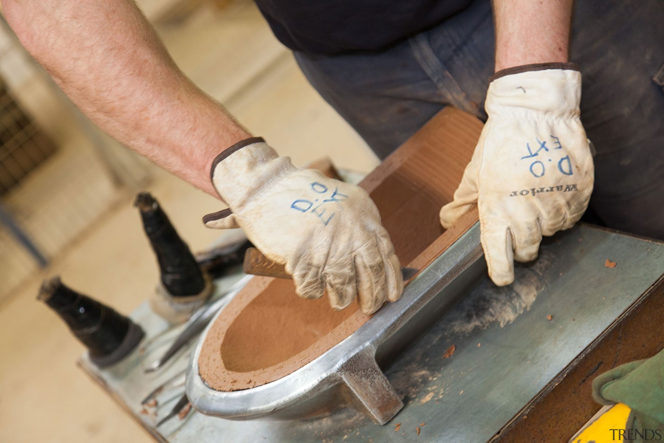 The raw beauty of hand crafted Monier terracotta footwear, hand, shoe, orange