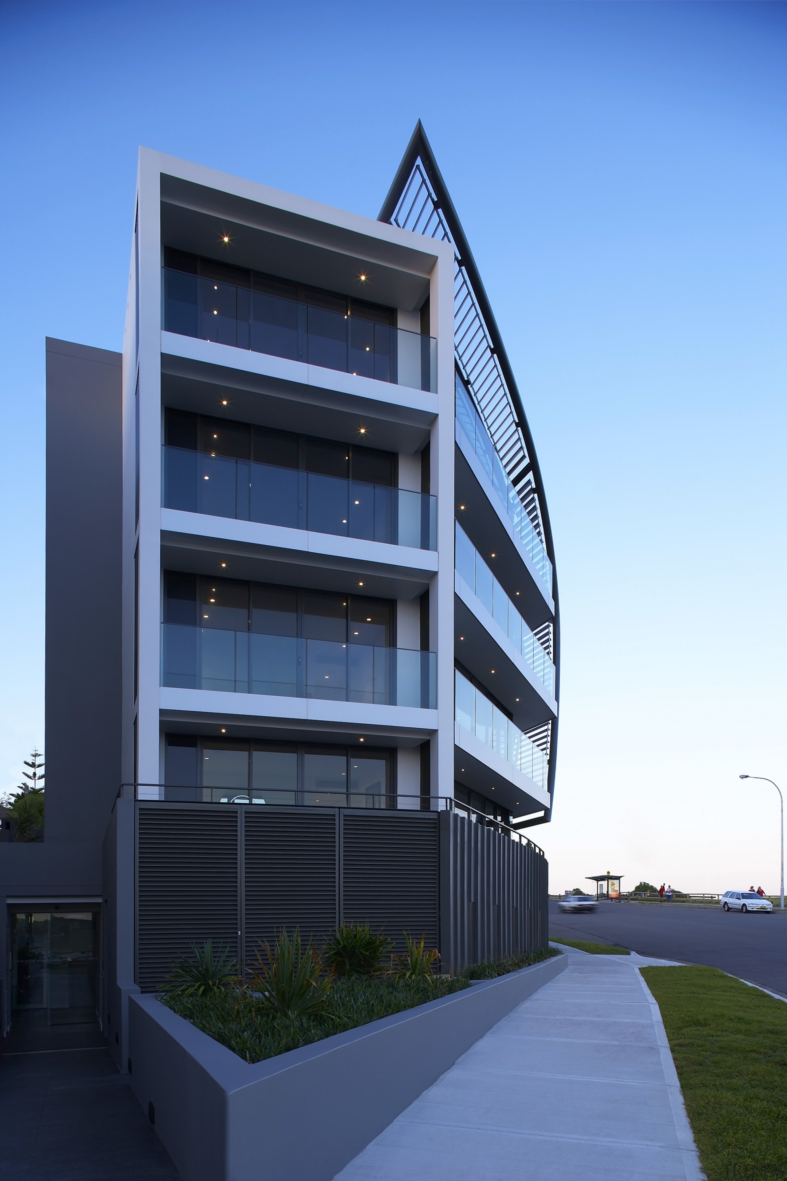 Exterior view of a Sydney apartment building which apartment, architecture, building, commercial building, condominium, corporate headquarters, daytime, elevation, facade, headquarters, home, house, mixed use, real estate, residential area, sky, teal, black