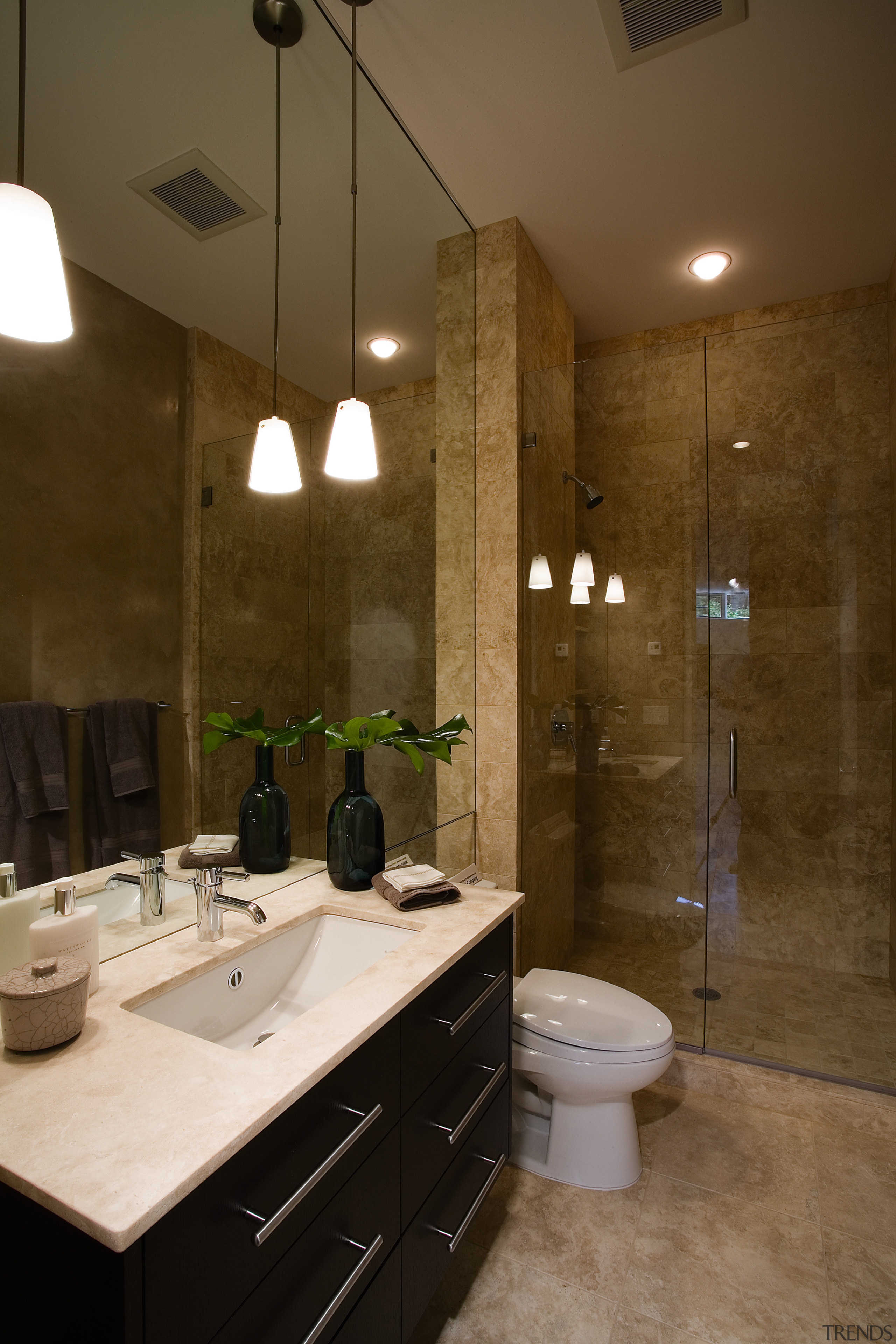 view of this bathroom featuring tiled flooring, dark bathroom, ceiling, countertop, floor, home, interior design, room, sink, tile, brown