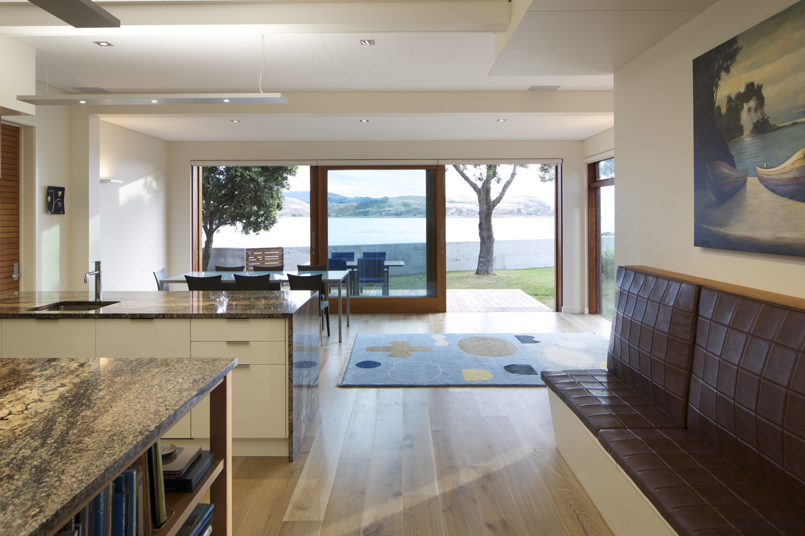 Coastal connections this house by Richard Middleton opens countertop, estate, floor, flooring, hardwood, house, interior design, kitchen, real estate, room, window, wood flooring, gray, brown