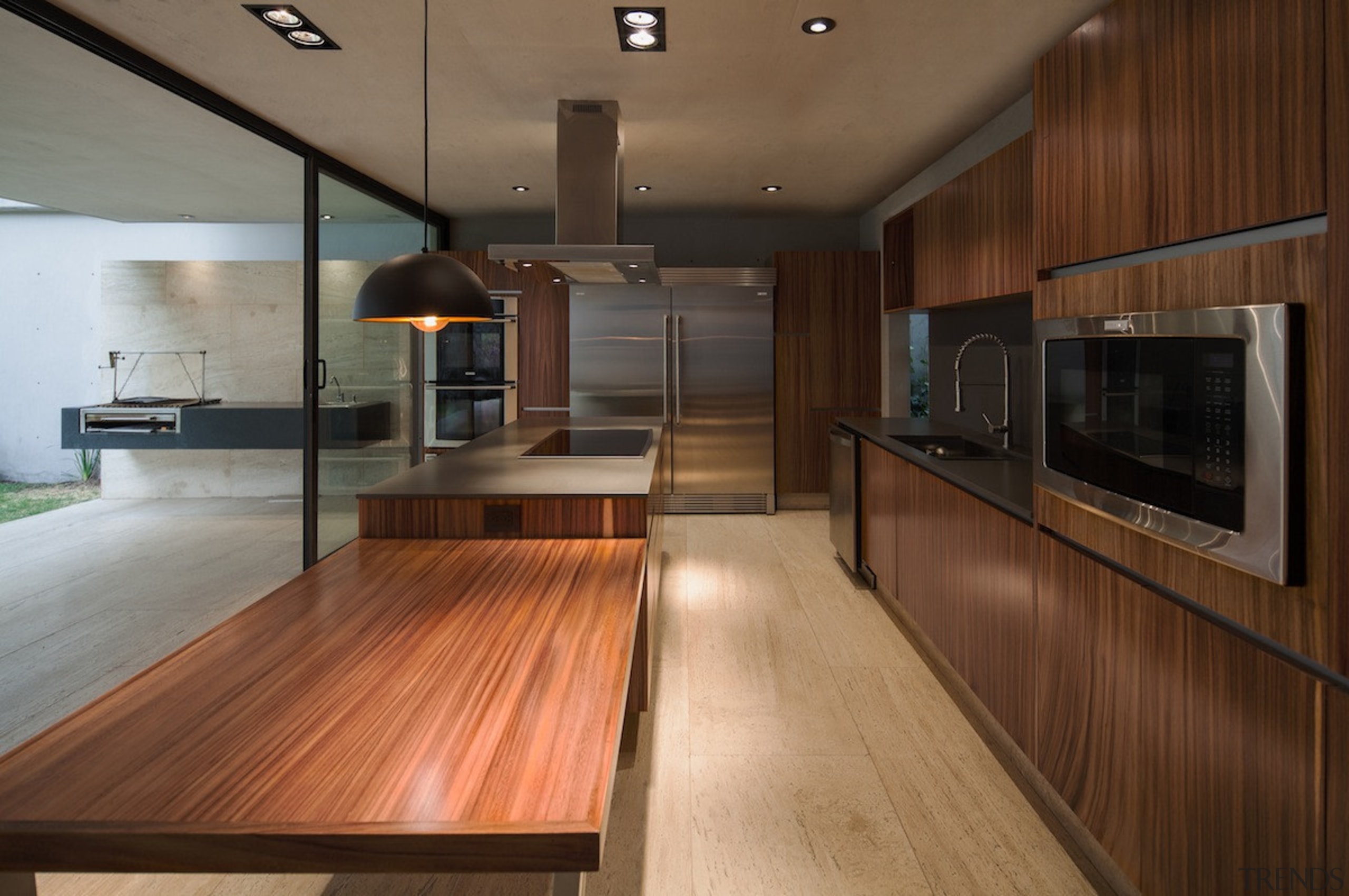 Wood runs throughout the kitchen - Wood runs cabinetry, countertop, floor, flooring, hardwood, interior design, kitchen, real estate, wood, wood flooring, brown