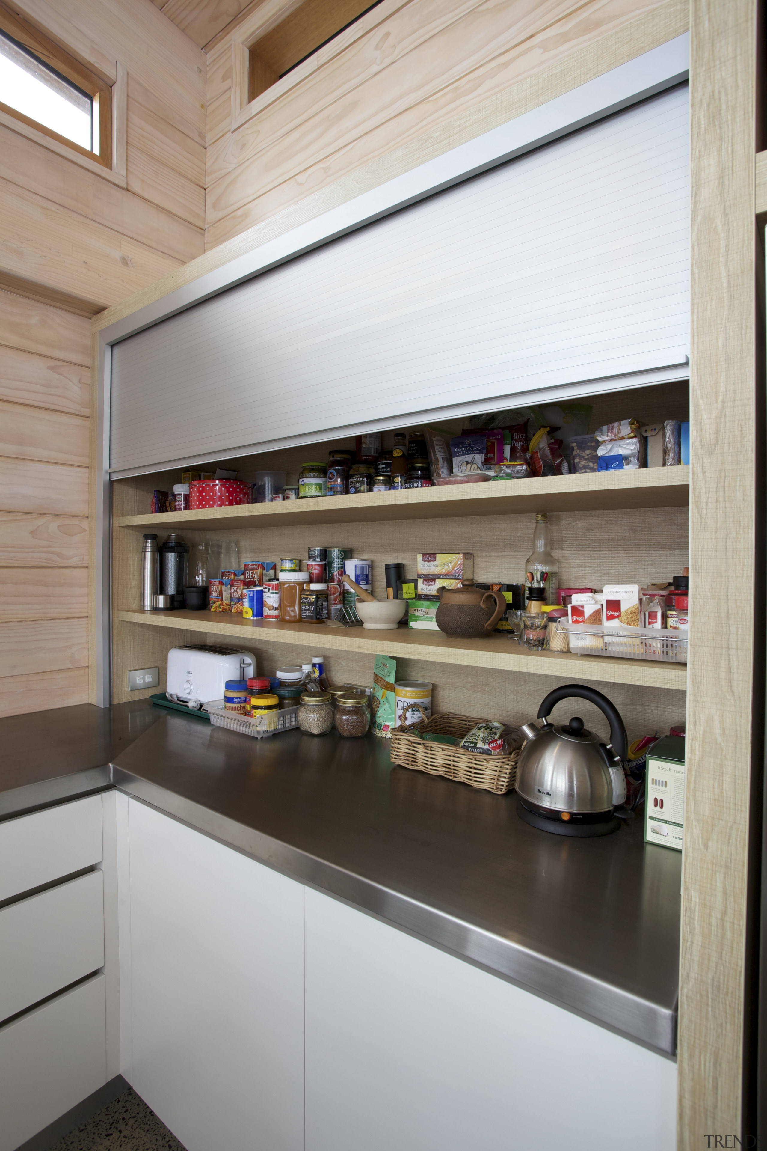 An aluminium door conceals the appliance garage and interior design, shelf, shelving, gray