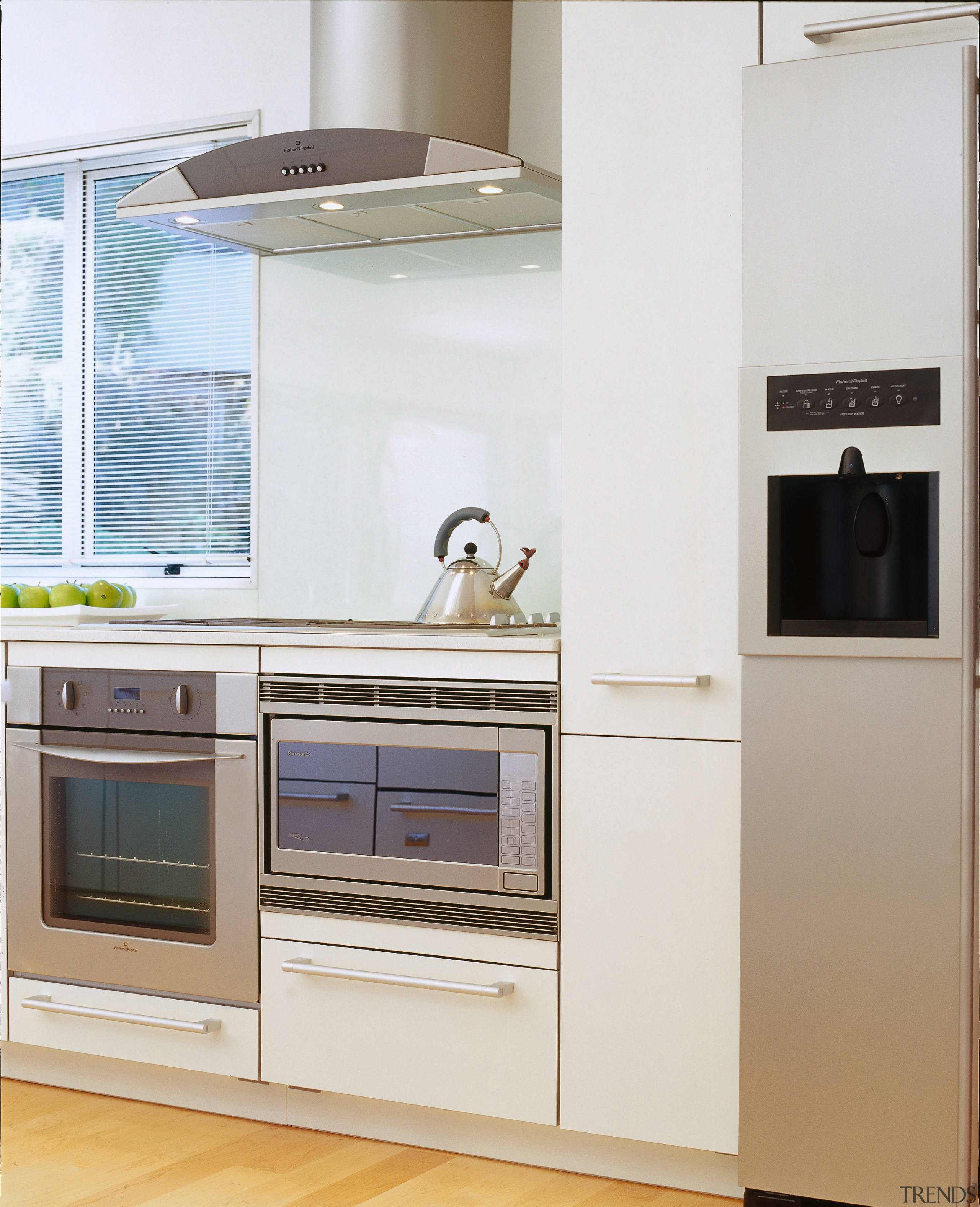 Kitchen with white cabinetry, and stainless steel finish cabinetry, countertop, cuisine classique, home appliance, kitchen, kitchen appliance, kitchen stove, major appliance, product, refrigerator, room, small appliance, white