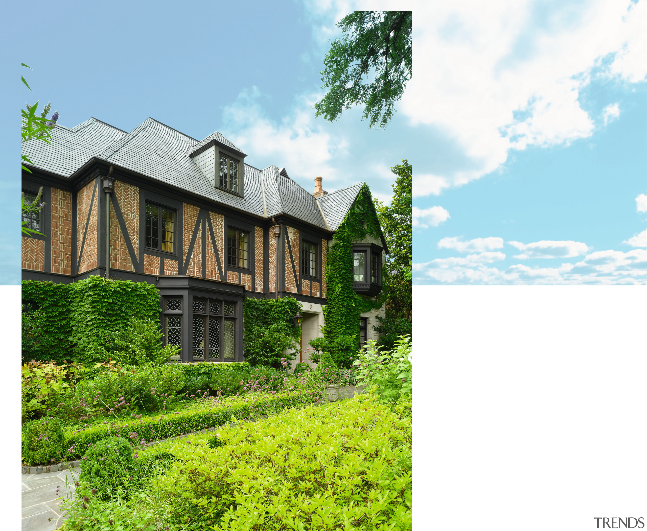 An exterior view of this traditional tudor style building, cottage, estate, facade, farmhouse, home, house, land lot, manor house, mansion, plantation, property, real estate, residential area, sky, tree, villa, white