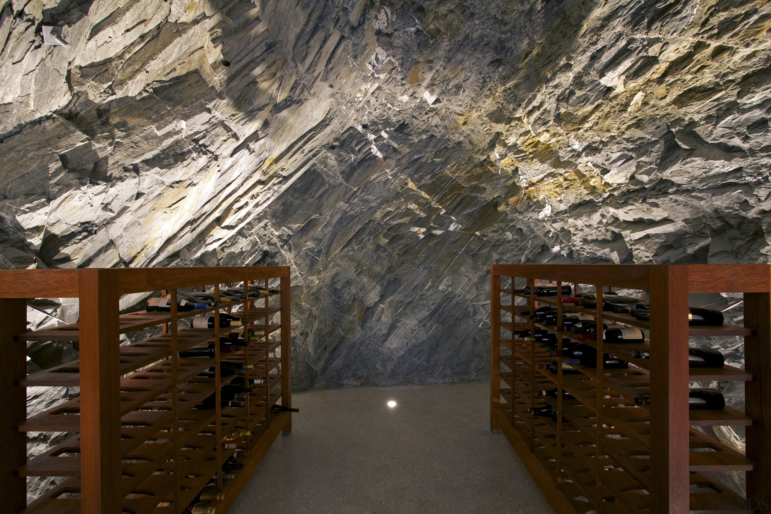 Tunnelled into the rock face, this wine cellar tourist attraction, wood, black, brown