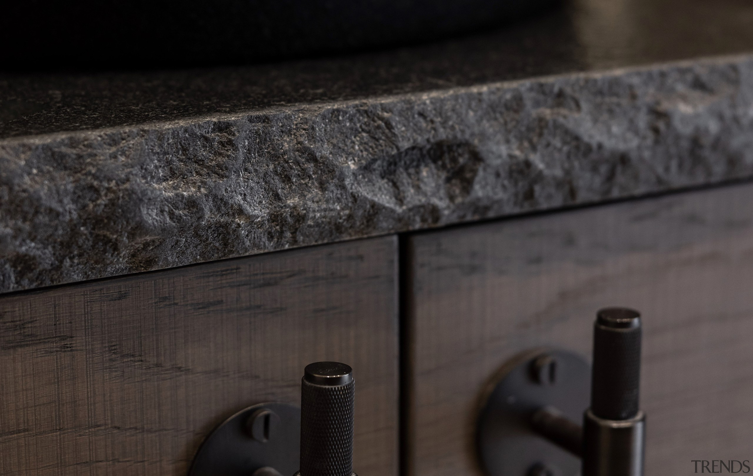 A rock edge stone benchtop adds to the 