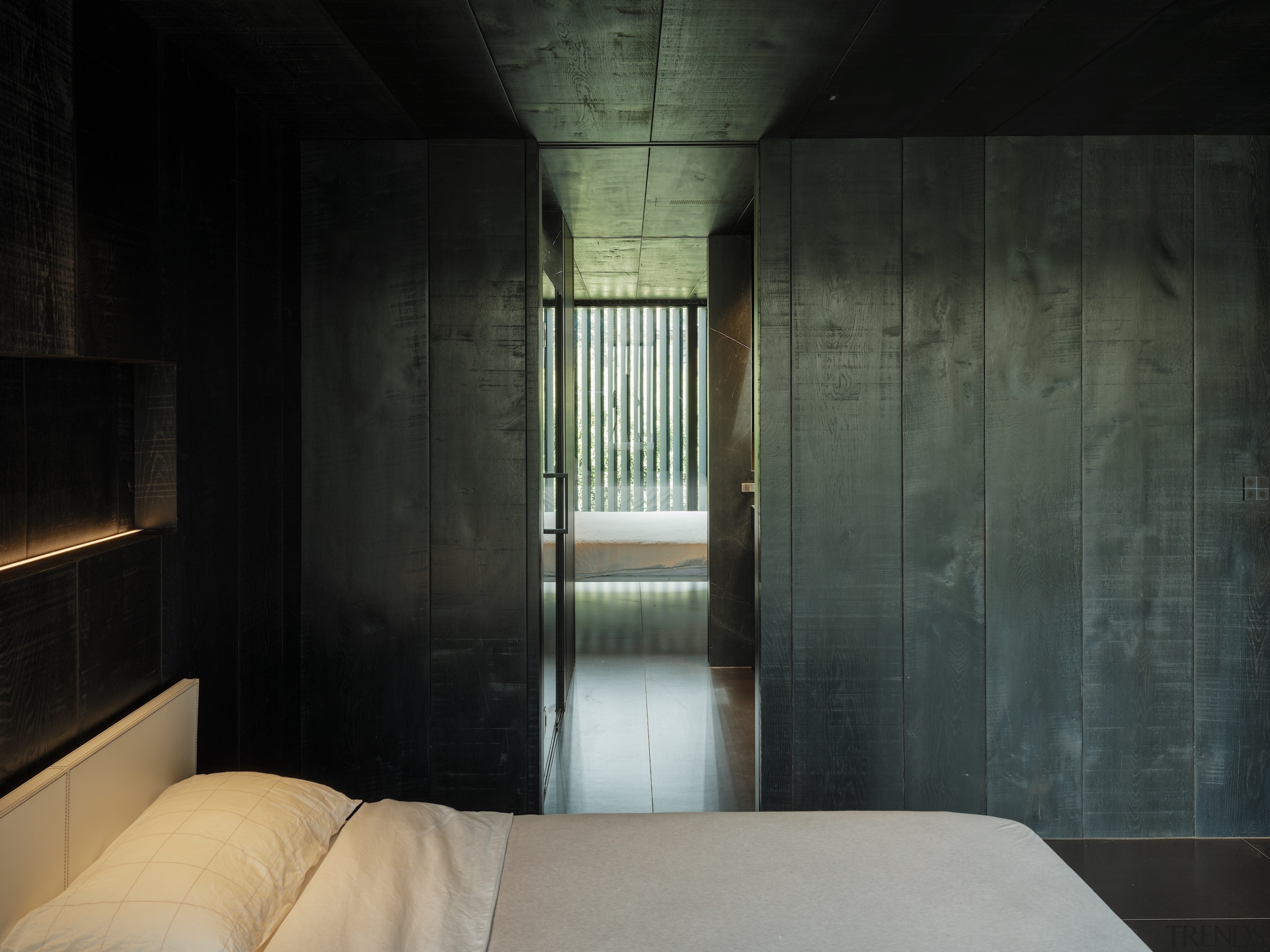 Looking from one bedroom through the shared bathroom 