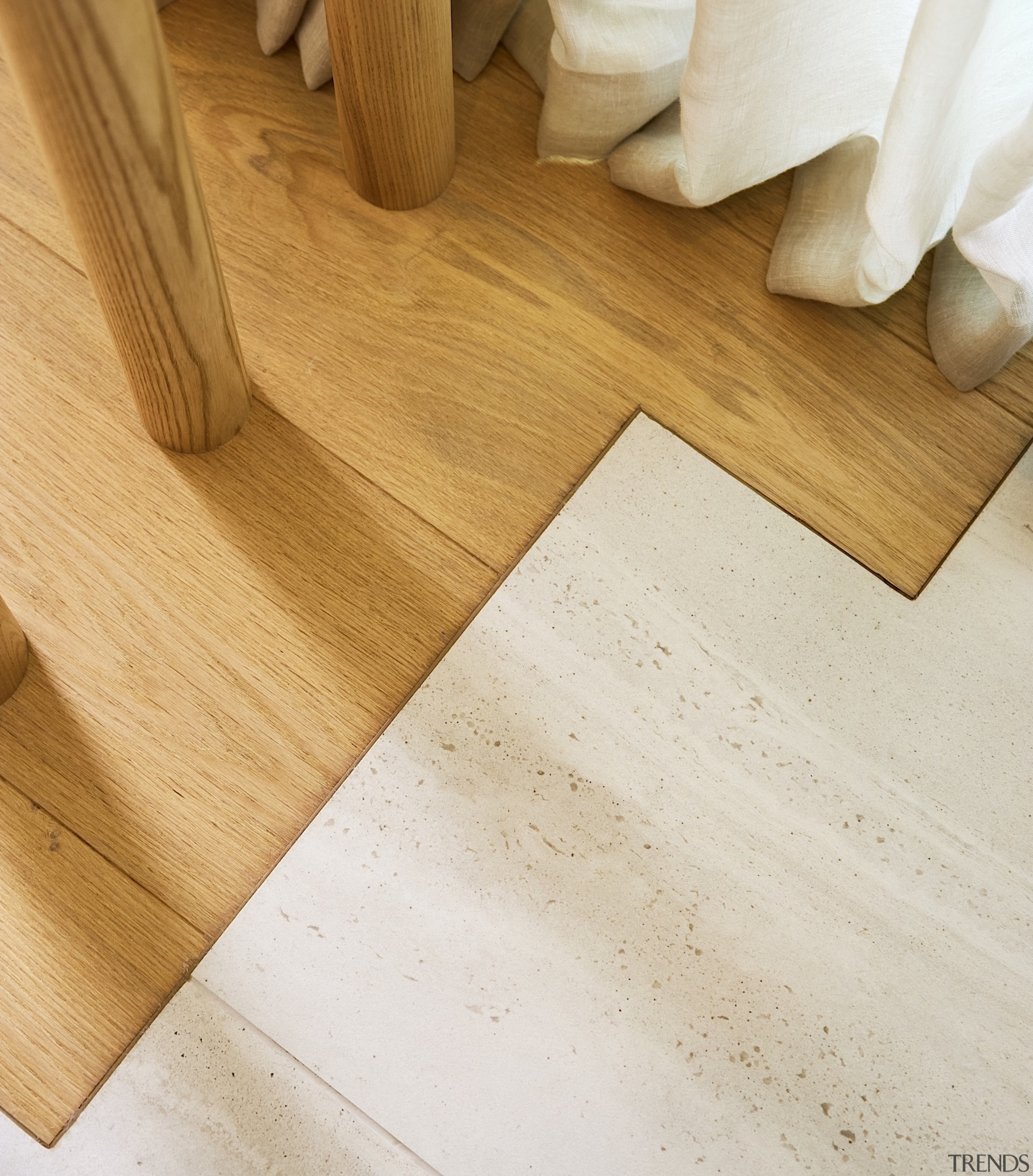 Where the wood bedroom floor meets the tiled 