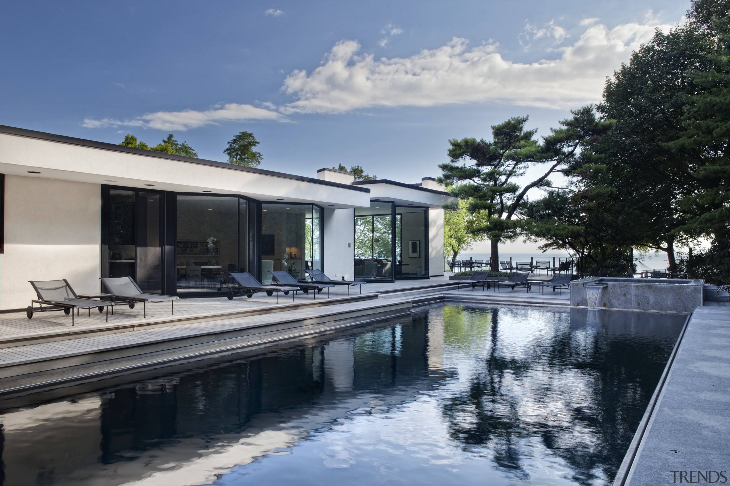 View of pool in a 1970's house that architecture, estate, home, house, property, real estate, reflection, swimming pool, villa, water, gray, black