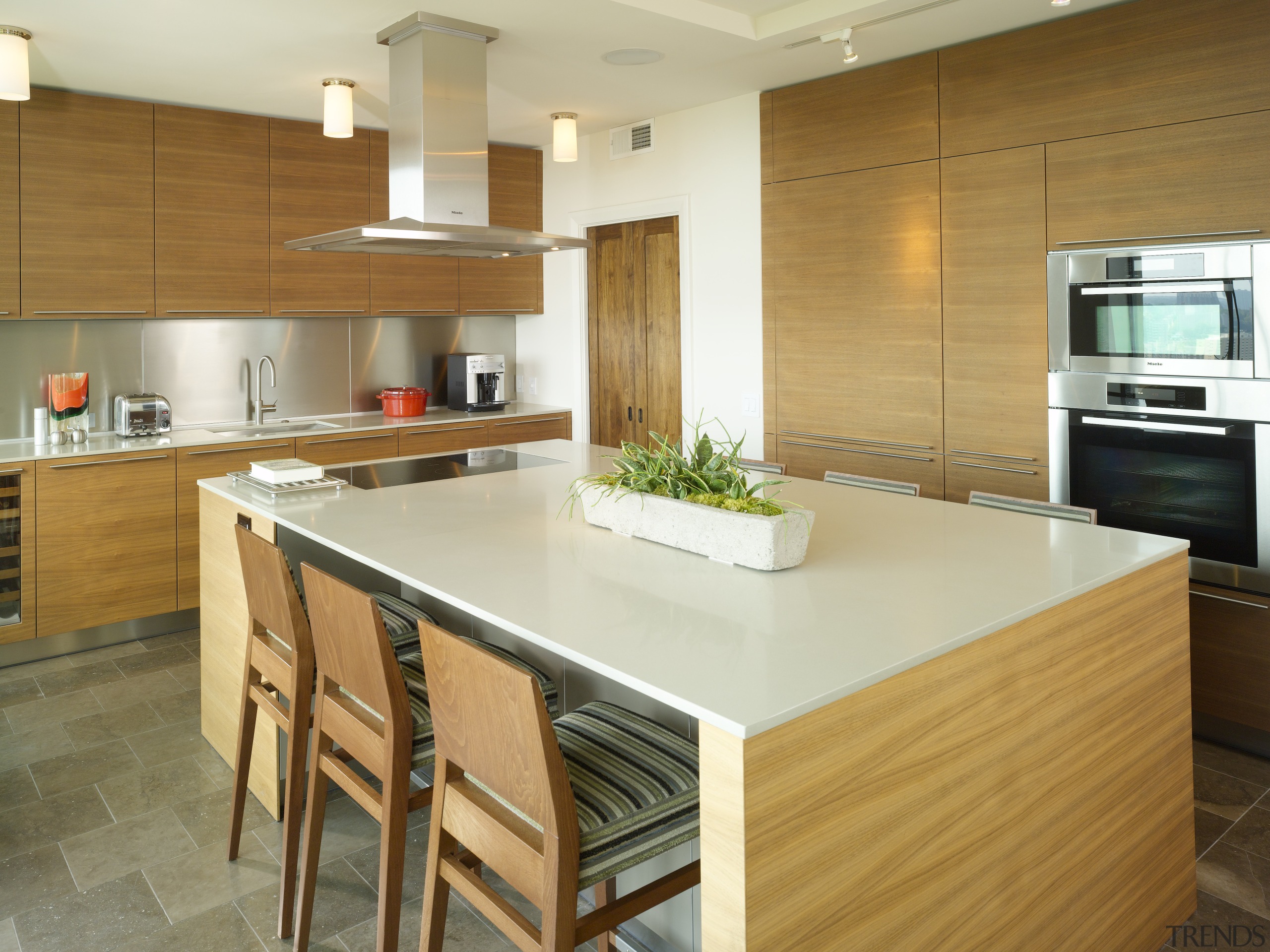 Architectural designer Mark Williams specified sleek Bulthaup walnut cabinetry, countertop, cuisine classique, floor, flooring, hardwood, interior design, kitchen, real estate, room, wood flooring, brown, orange