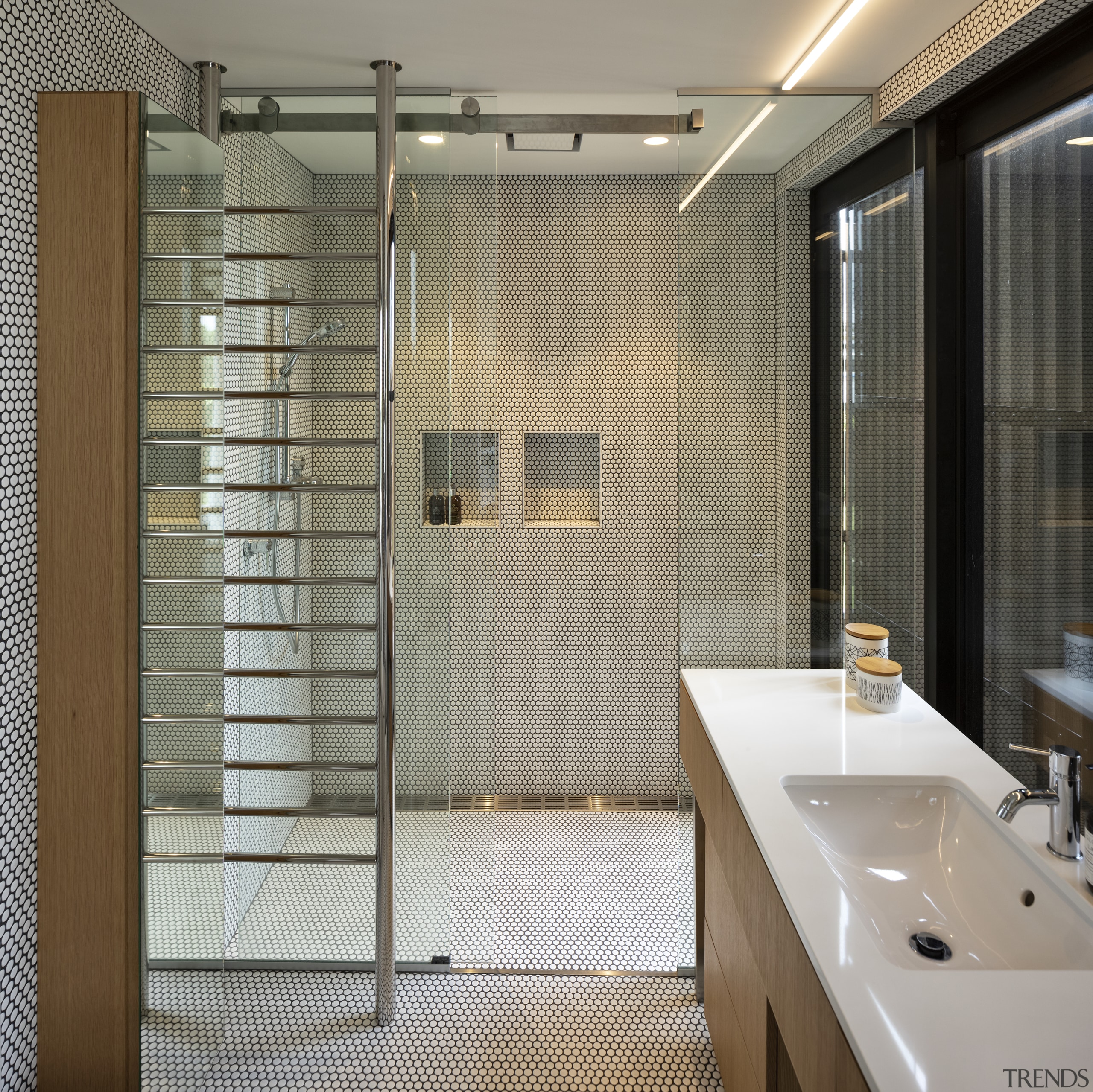 Glass, chrome and mosaics make for a clean, 