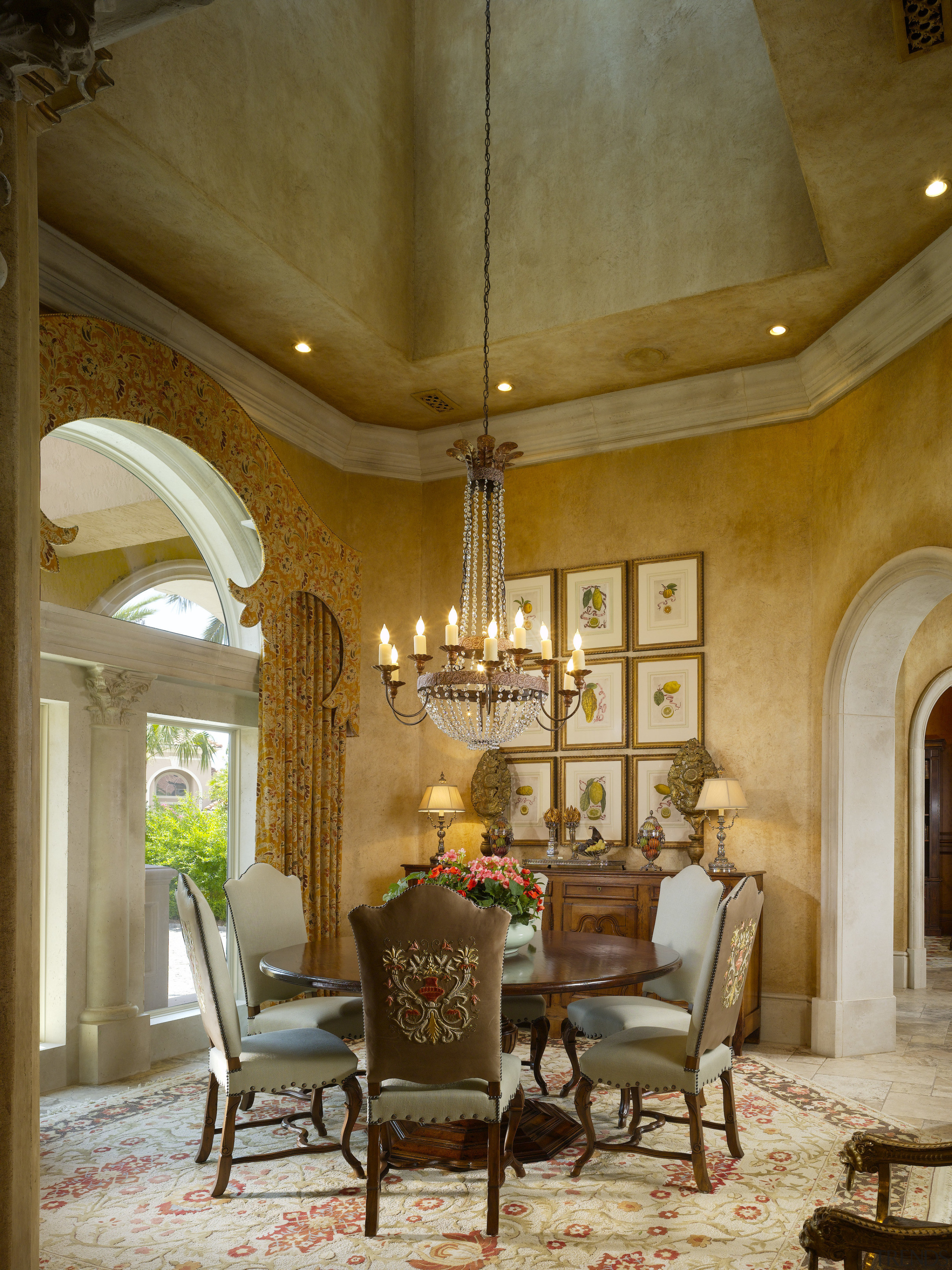 View of a dining area with tiled floors, ceiling, chandelier, dining room, estate, home, interior design, living room, room, table, wall, brown