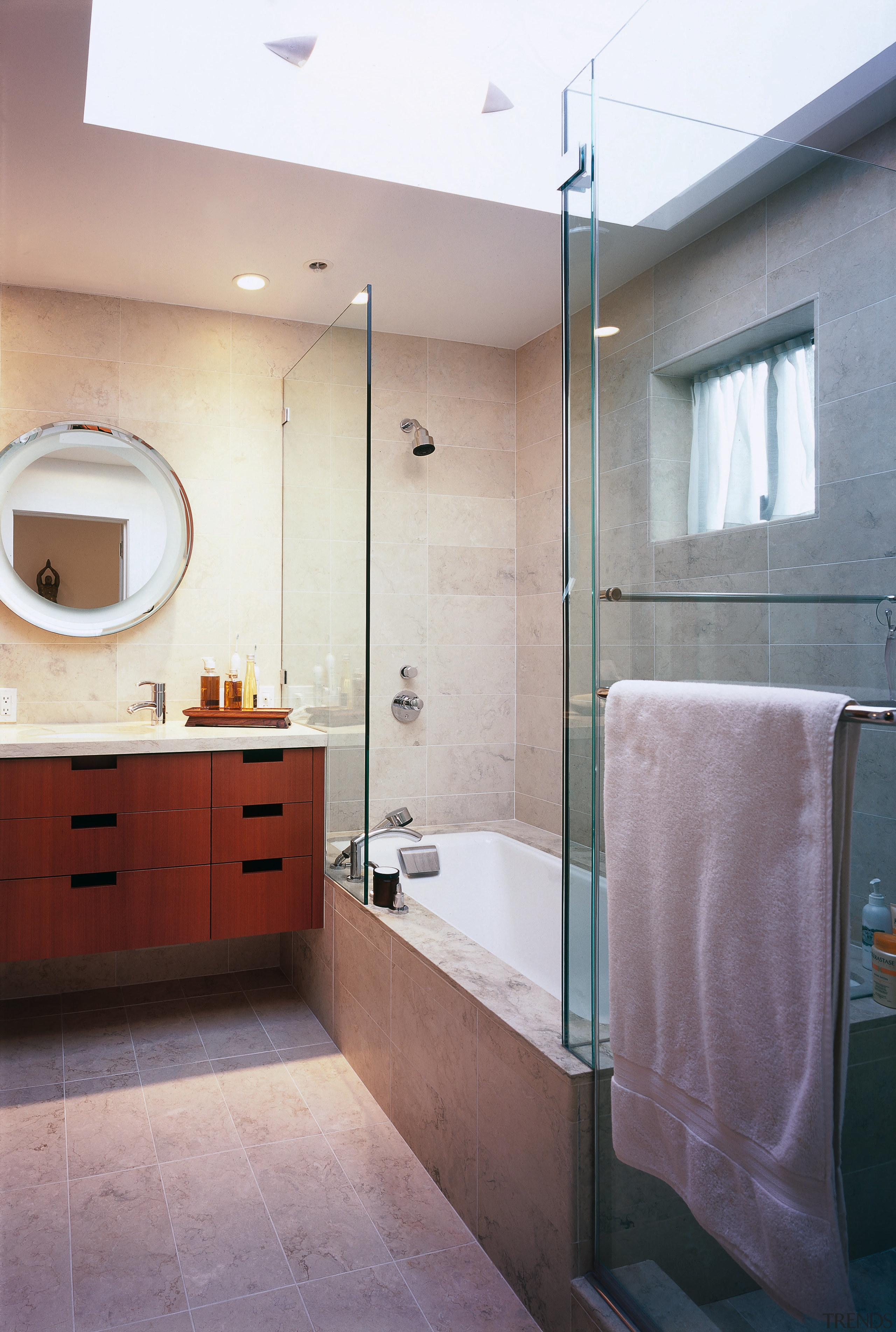view of the bathroom featuring glass shower enclosure, bathroom, bathroom accessory, bathroom cabinet, floor, home, interior design, plumbing fixture, room, sink, gray