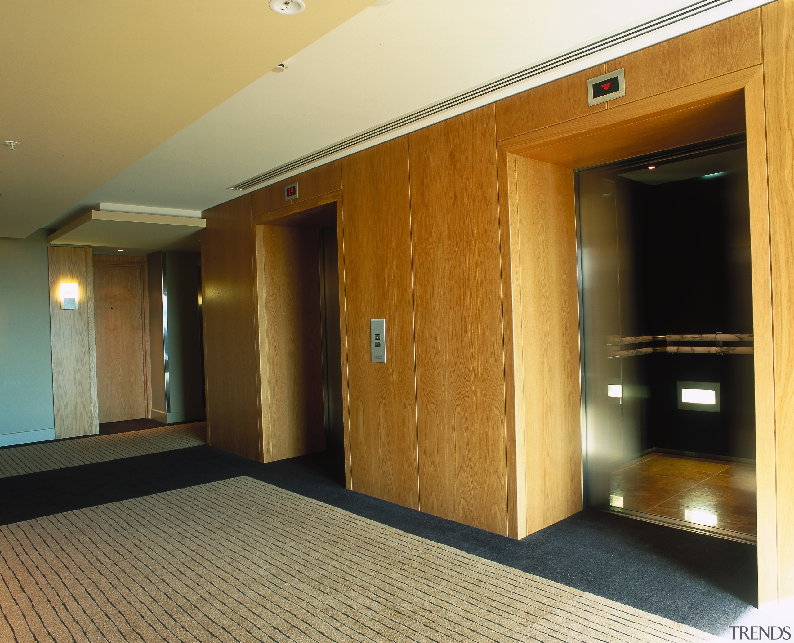 Lobby area with veneered wall panels. - Lobby ceiling, door, floor, flooring, hardwood, interior design, laminate flooring, property, real estate, room, wall, wood, wood flooring, brown