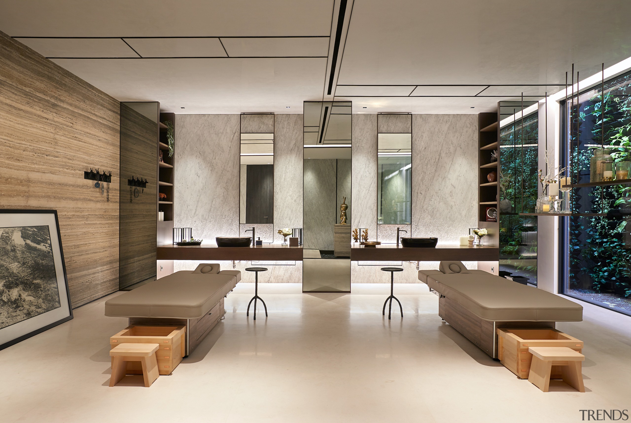 Massage room with stone walls and feature mirrors. 