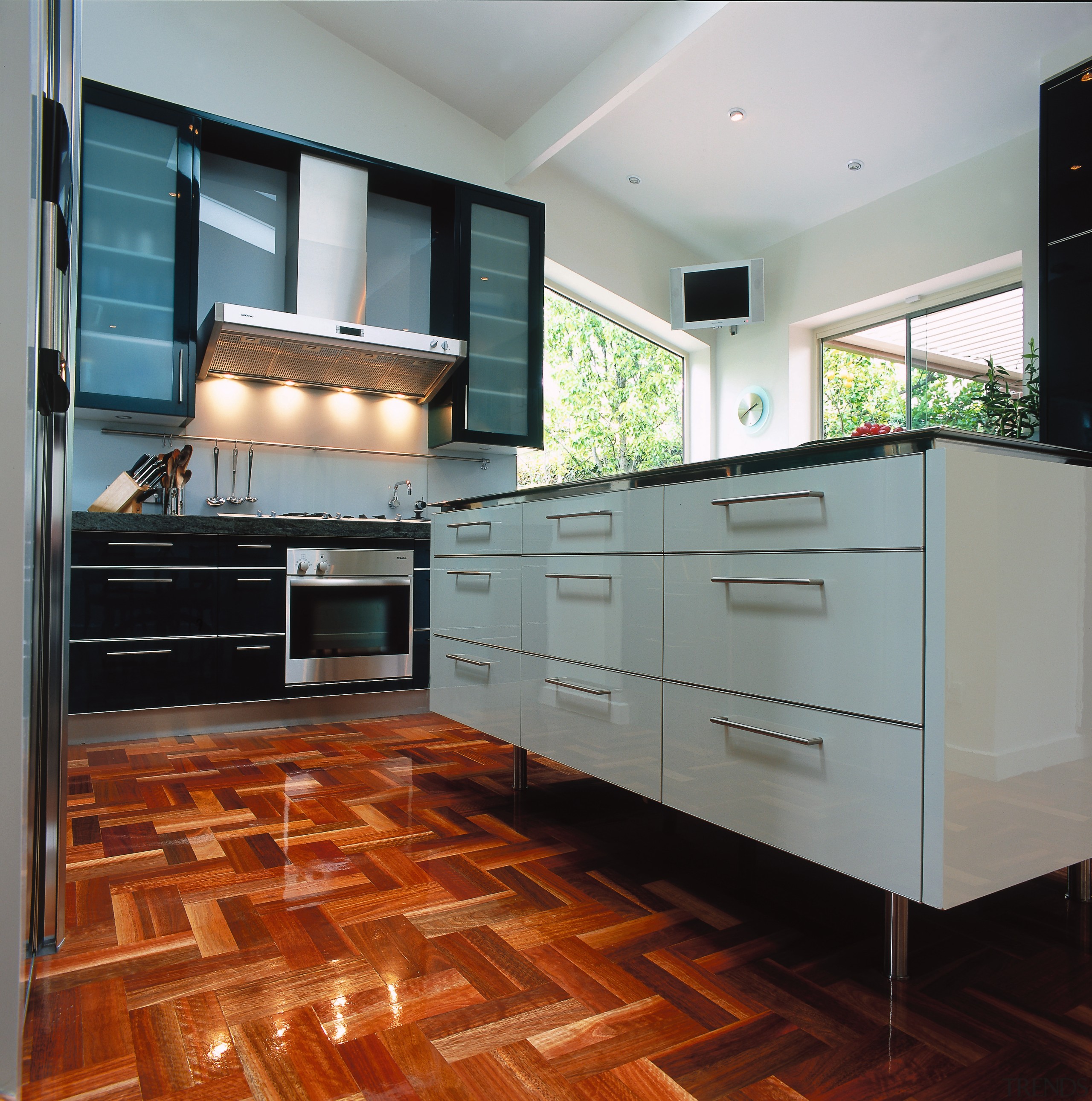 view of the kitchen cabinetry and food preparation cabinetry, countertop, cuisine classique, floor, flooring, hardwood, interior design, kitchen, laminate flooring, room, tile, wood flooring, gray