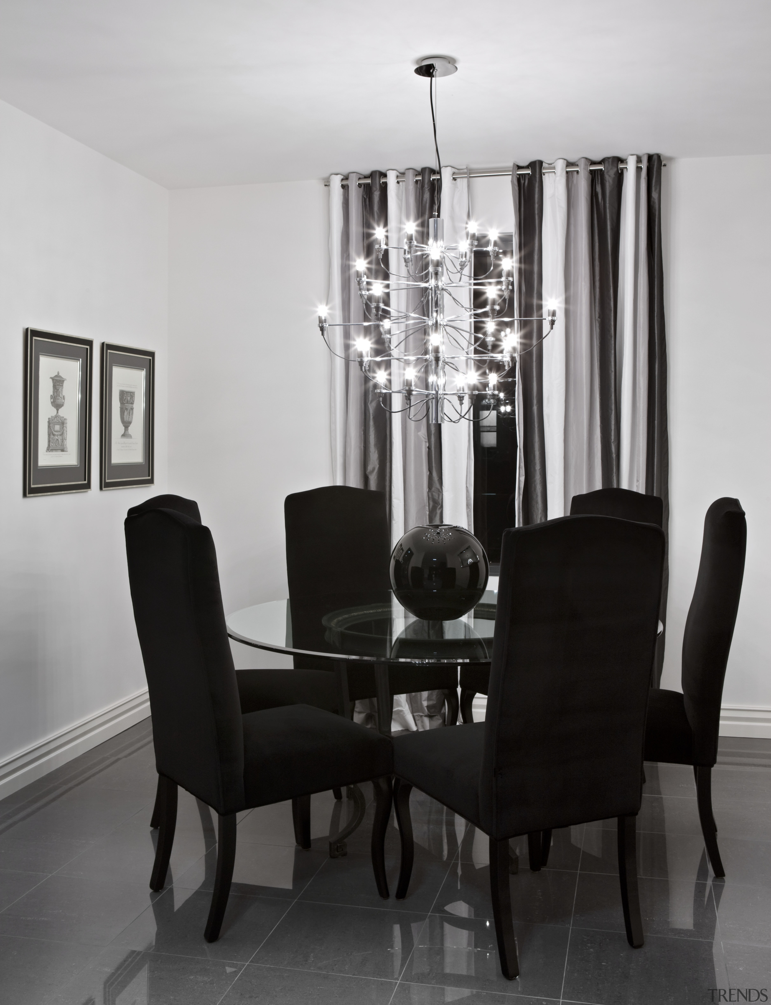 Dining room with chandelier, curtains, artwork, dining furnishings, chair, chandelier, dining room, furniture, interior design, light fixture, lighting, room, table, gray, black