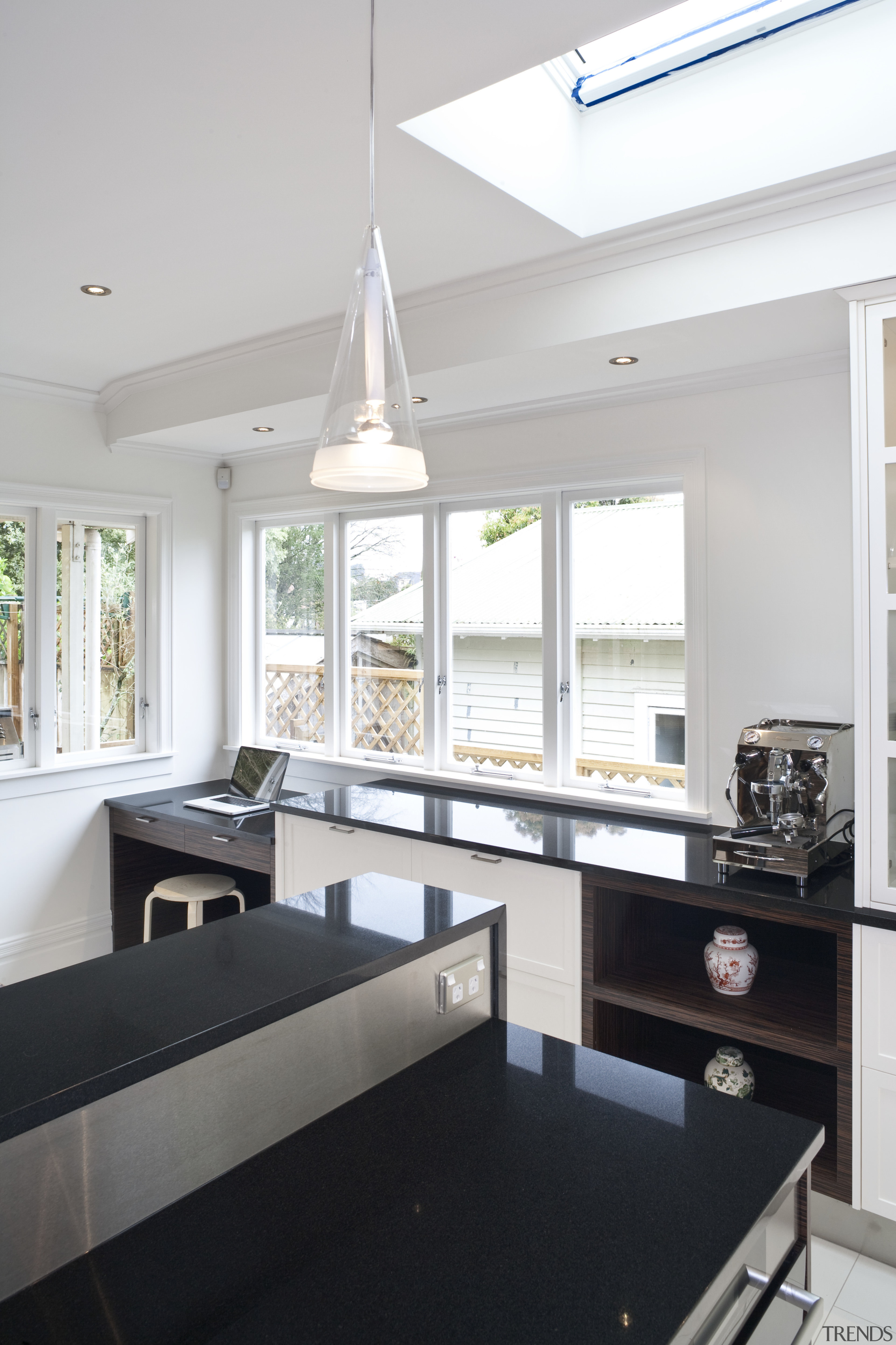This renovated kitchen features indian black granite benchtops, countertop, daylighting, house, interior design, kitchen, living room, room, window, white