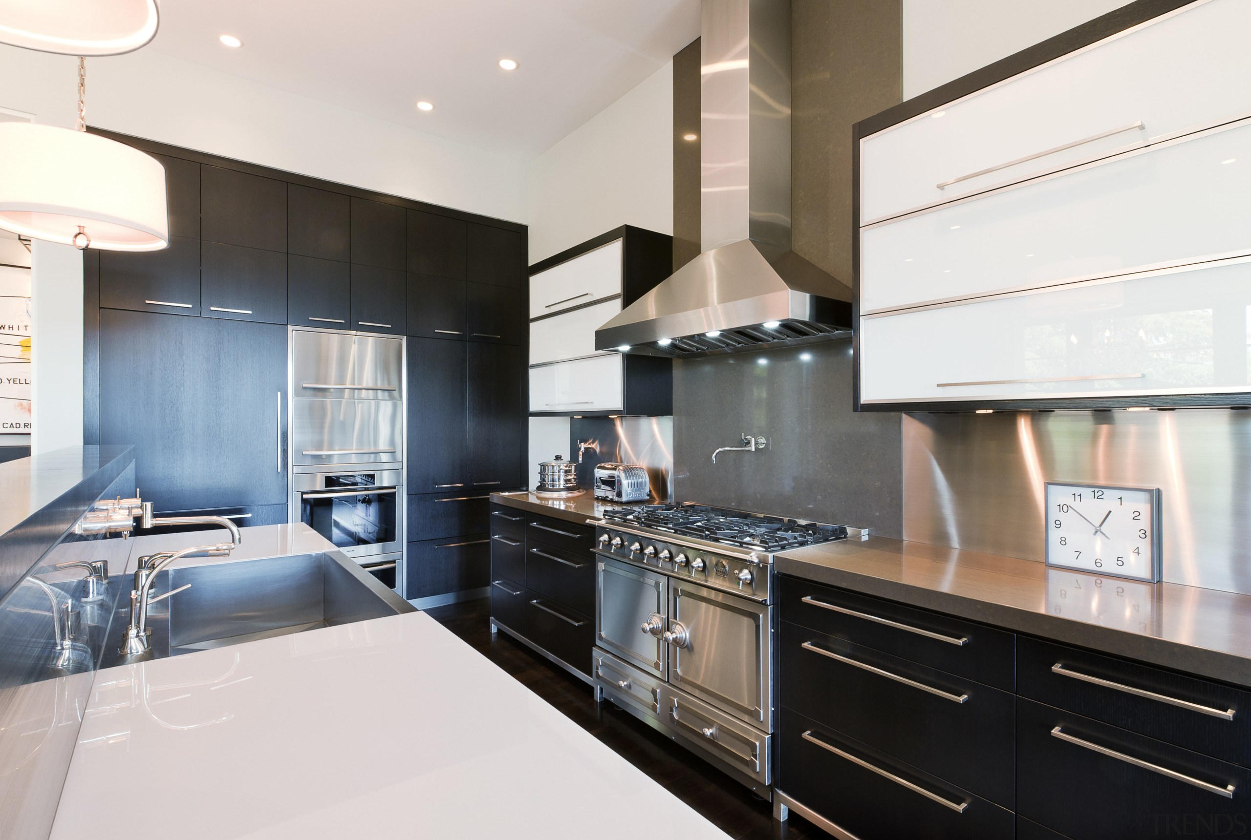 View of kitchen area that features cafe-styled bar, cabinetry, countertop, cuisine classique, interior design, kitchen, real estate, room, white
