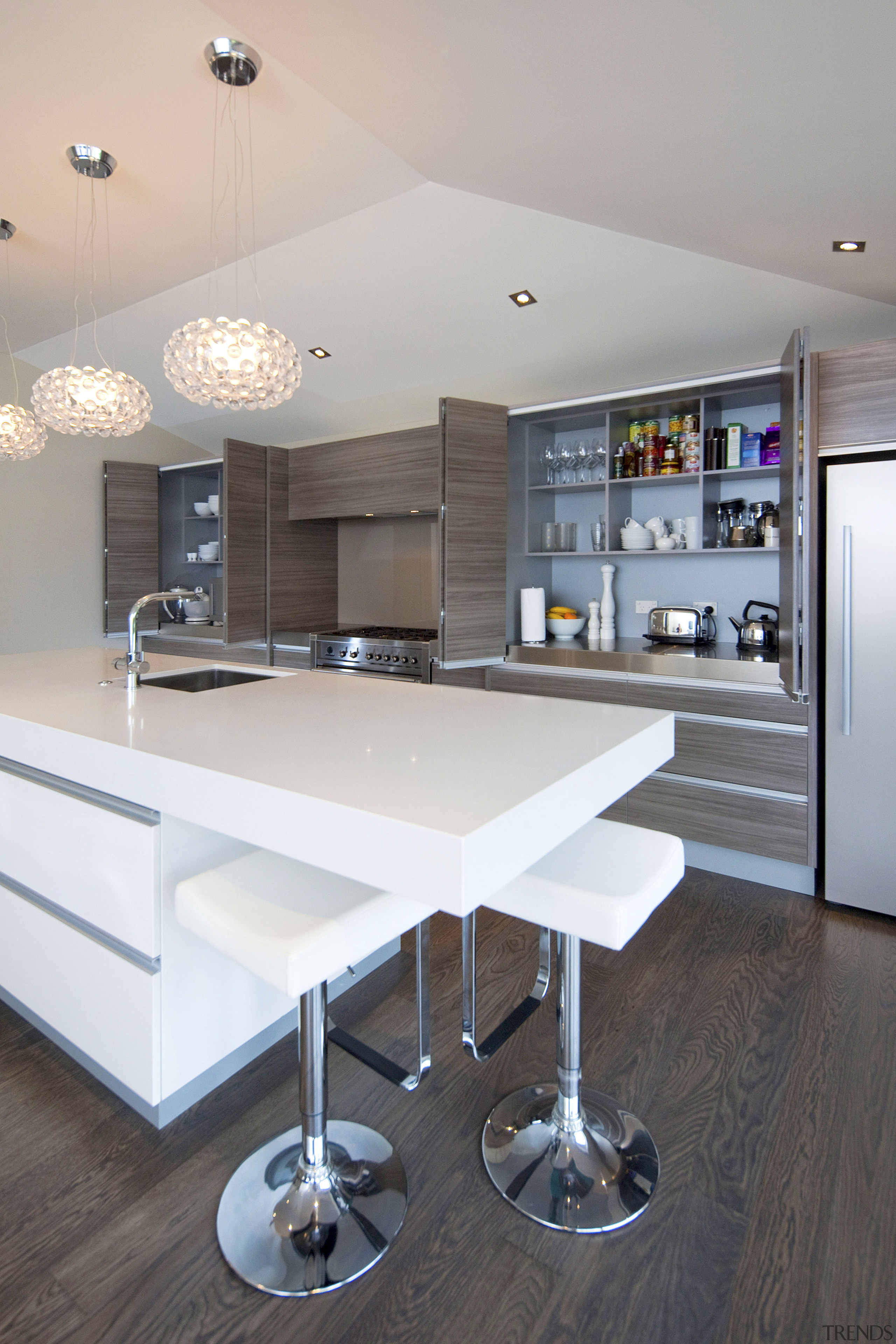 View of a kitchen which features white CeasarStone ceiling, countertop, floor, furniture, interior design, kitchen, room, table, gray