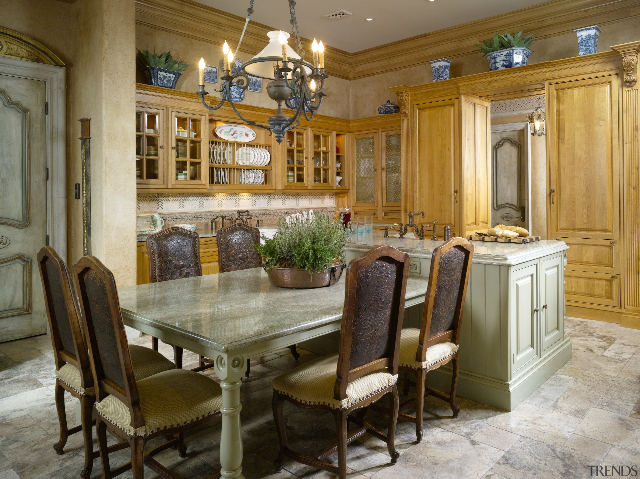 View of a dining area with tiled floors, cabinetry, ceiling, countertop, cuisine classique, dining room, estate, furniture, home, interior design, kitchen, real estate, room, table, brown, gray