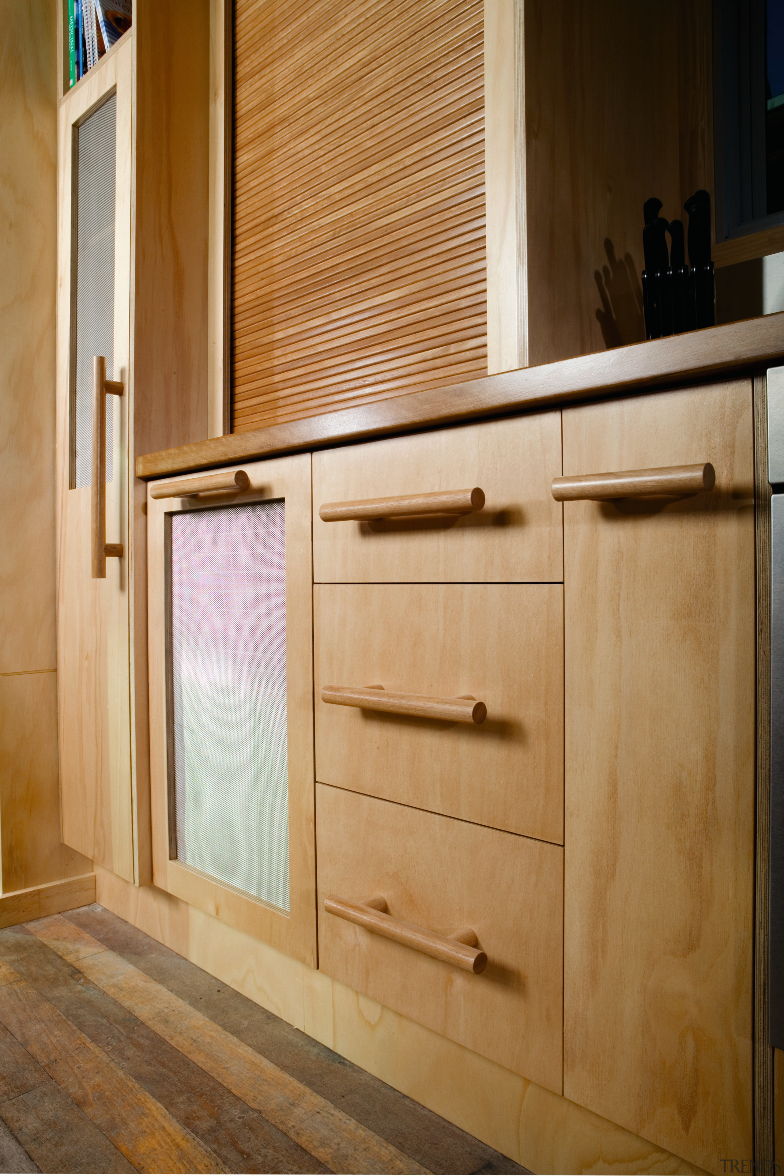 A view of a kitchen designed and manufactured cabinetry, chest of drawers, countertop, cupboard, drawer, floor, furniture, hardwood, interior design, kitchen, plywood, sideboard, wood, wood stain, brown, orange