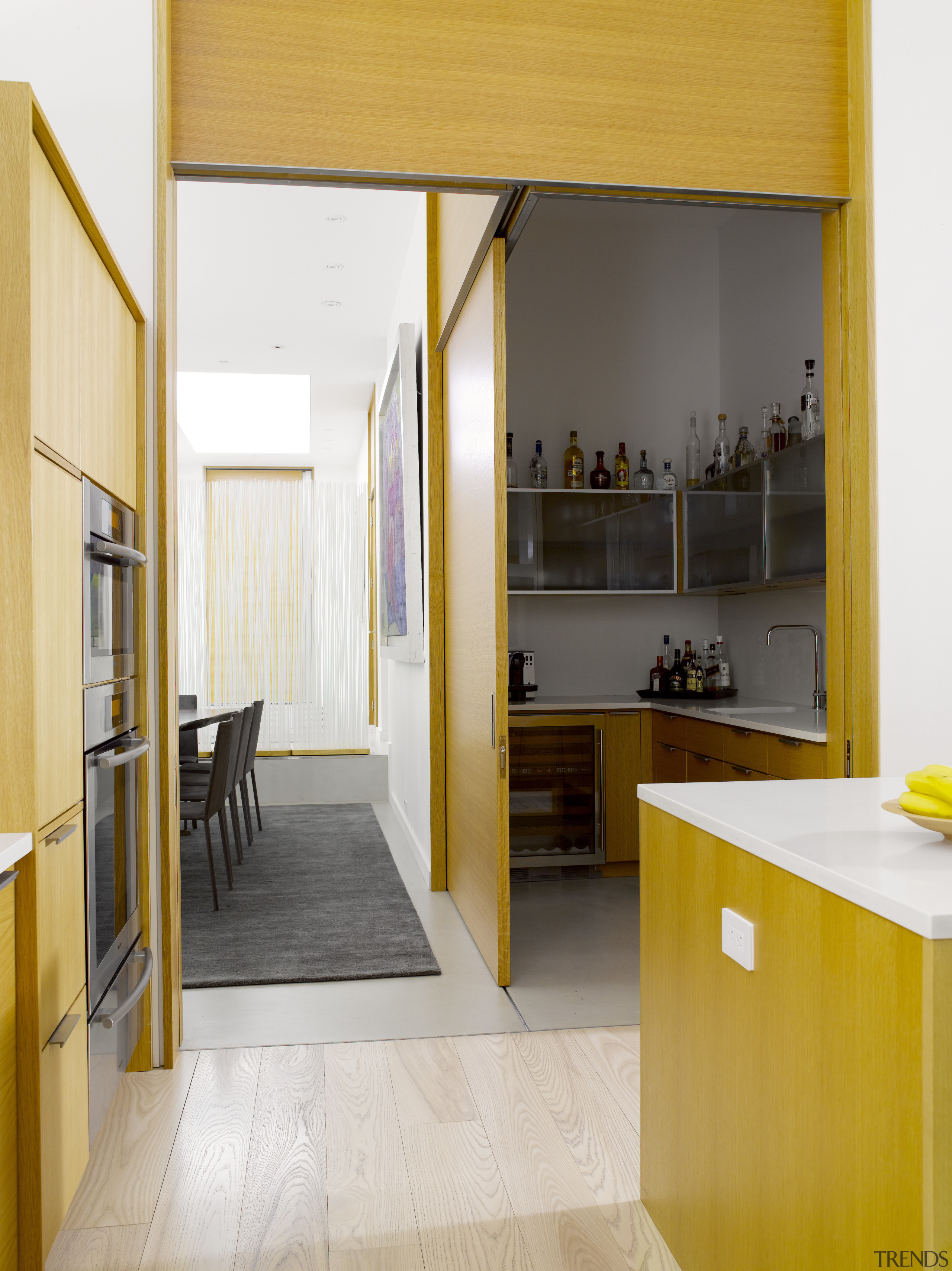Seen here is a kitchen designed by Geoffrey architecture, cabinetry, countertop, door, floor, flooring, house, interior design, kitchen, white, orange