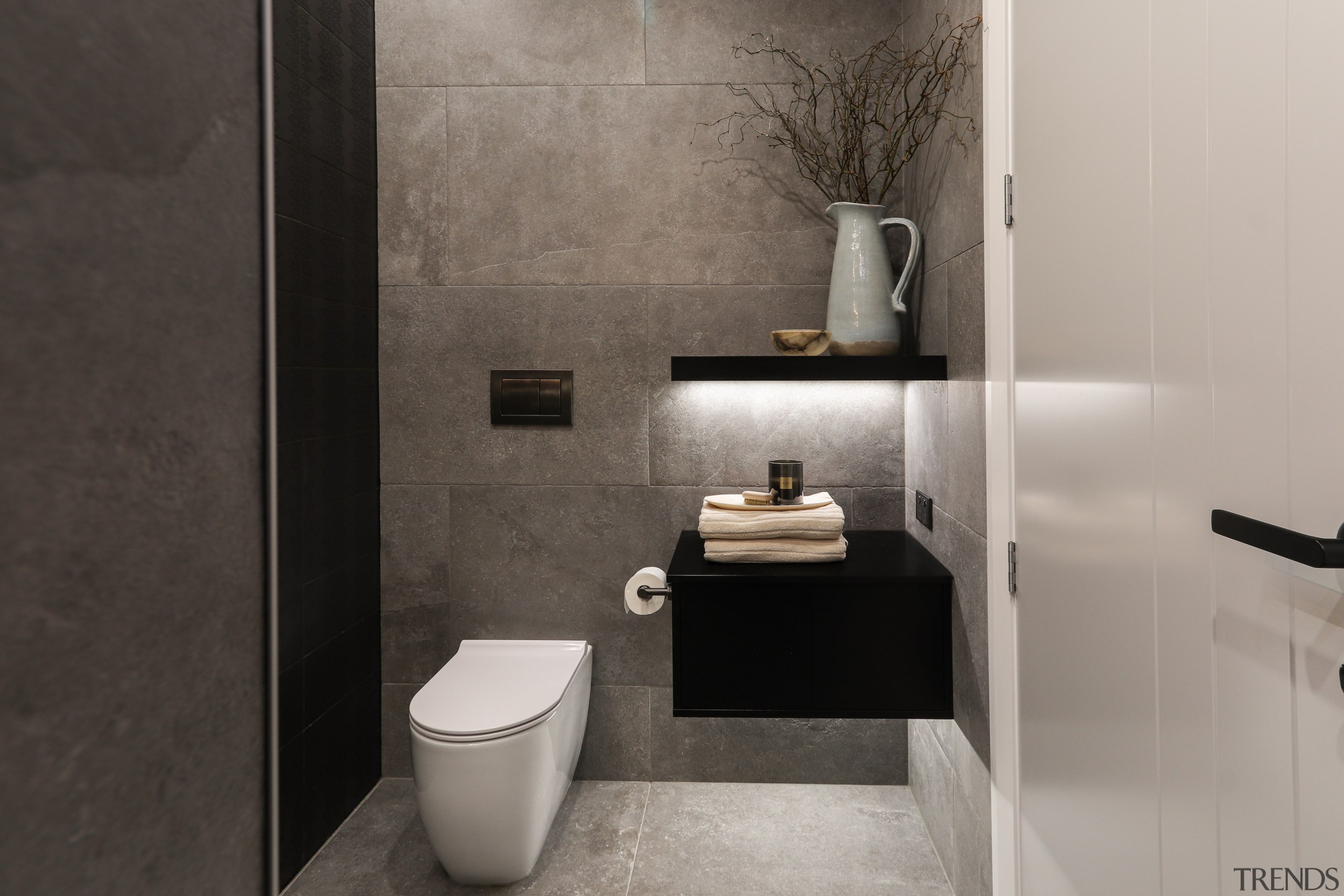 The toilet roll holder has been placed to 