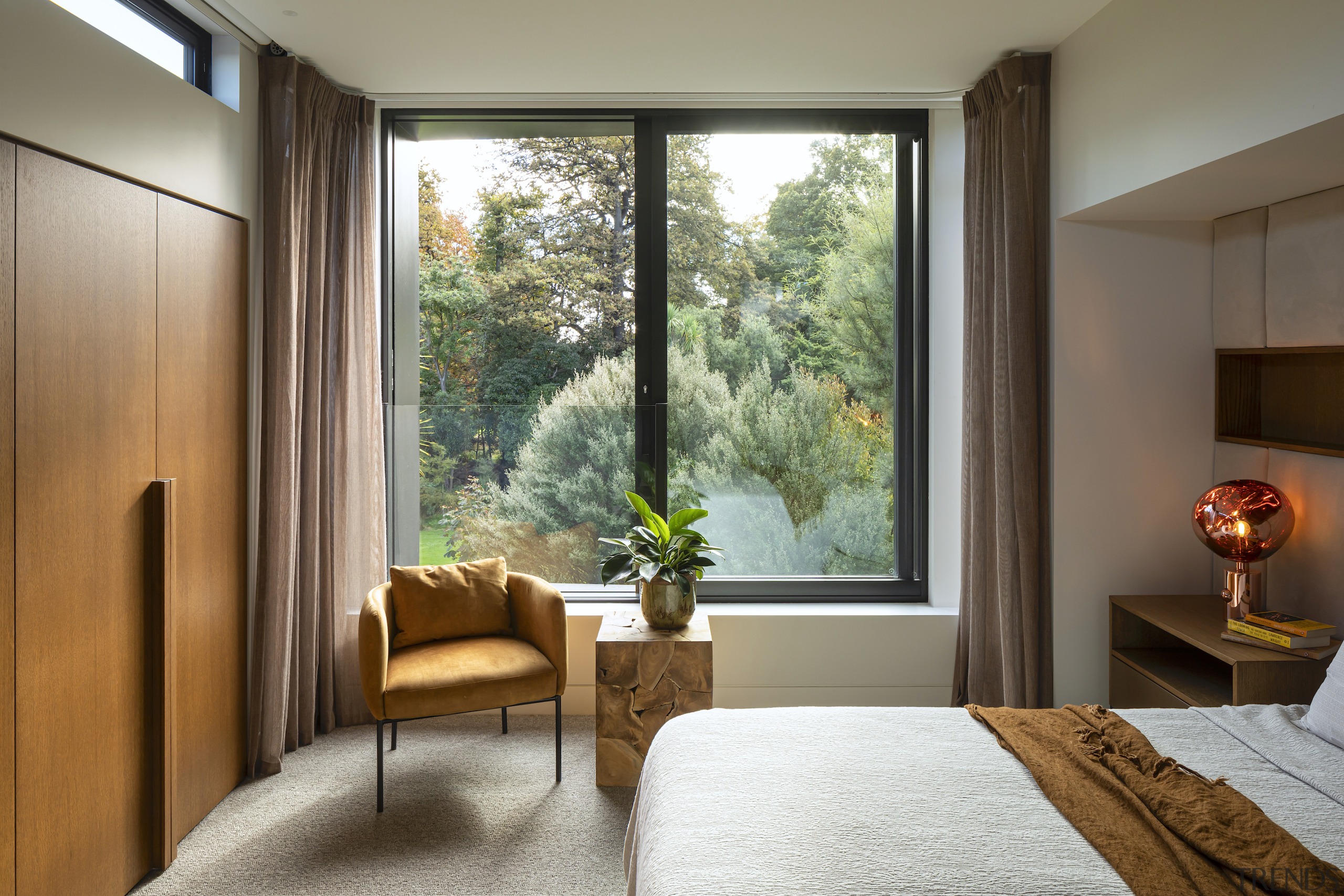 Master bedroom with clerestory window and built-in storage. 