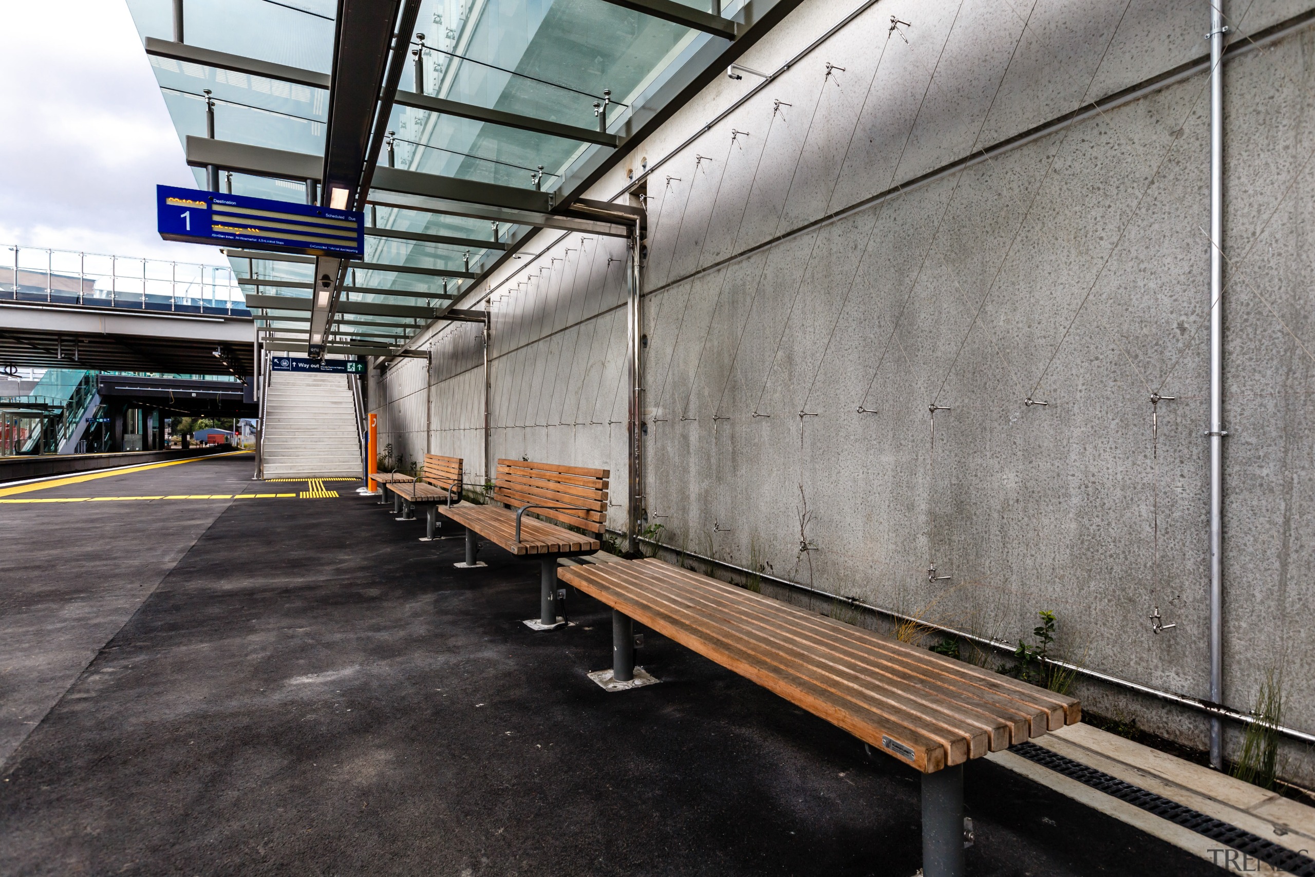 A substantial, timber-clad gullwing roof appears to float public transport, structure, transport, urban area, wood, gray, black