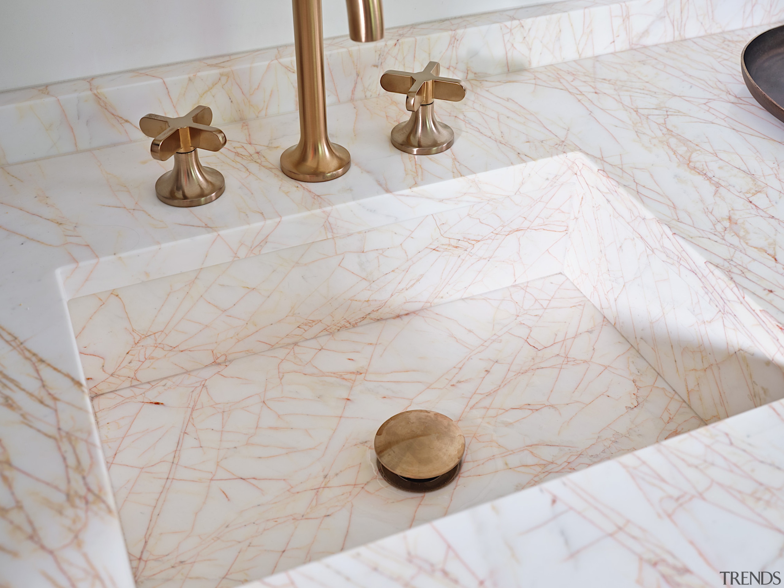 The vanity sink looks like it is carved 
