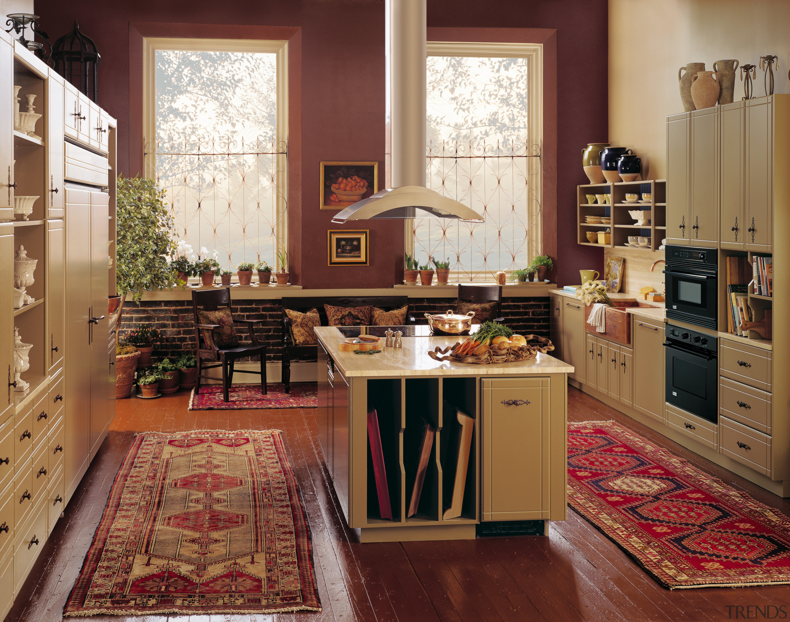 View of a kitchen, wooden flooring, red rugs, cabinetry, countertop, cuisine classique, floor, flooring, furniture, hardwood, home, interior design, kitchen, living room, room, window, wood, brown, red