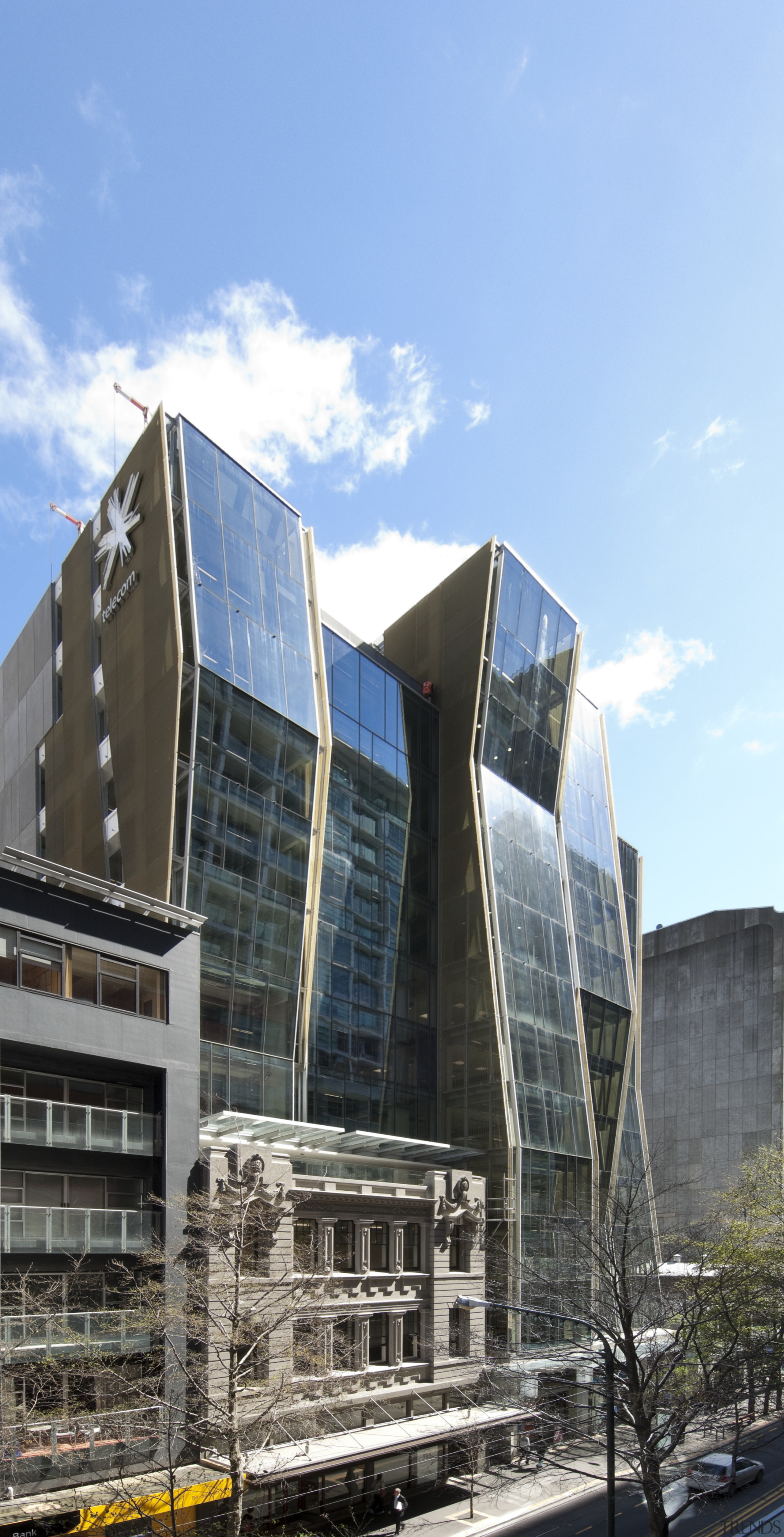 Here is a view of the new Telecom architecture, building, city, commercial building, condominium, corporate headquarters, daytime, facade, headquarters, metropolis, metropolitan area, mixed use, reflection, sky, skyscraper, teal, black