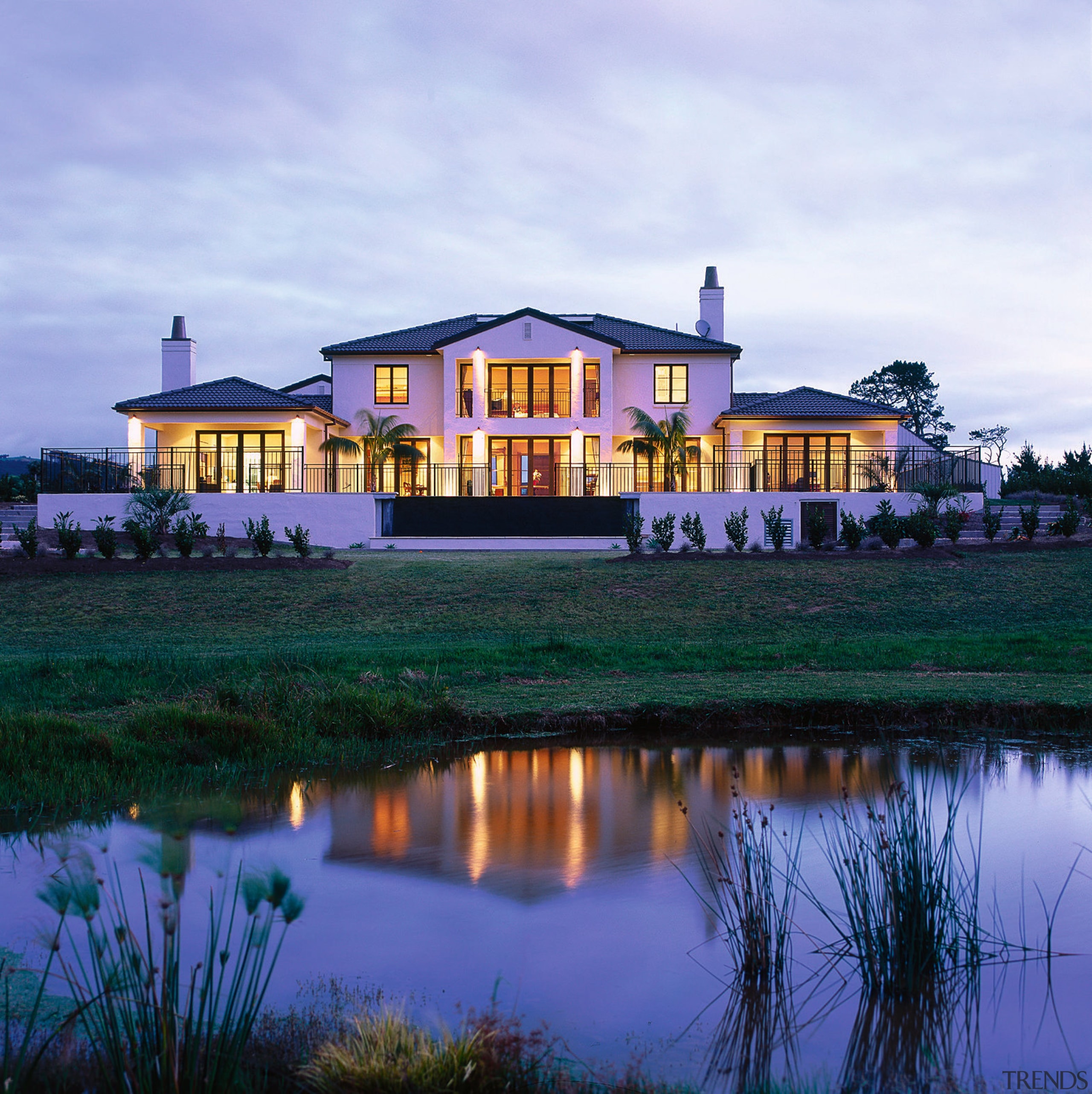 Overall view of a Firth Masonry Villa. The cottage, estate, evening, facade, home, house, landscape, mansion, property, real estate, reflection, sky, villa, water, teal, blue