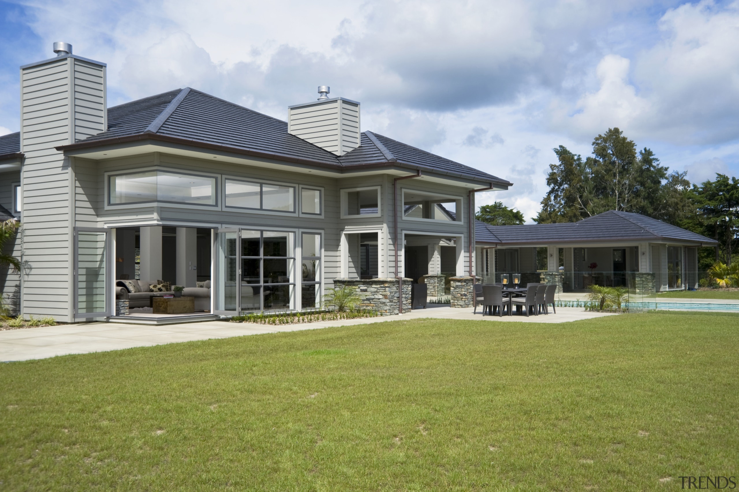 Image of this family home which creates a cottage, elevation, estate, facade, farmhouse, home, house, mansion, property, real estate, residential area, roof, siding, villa, window, white