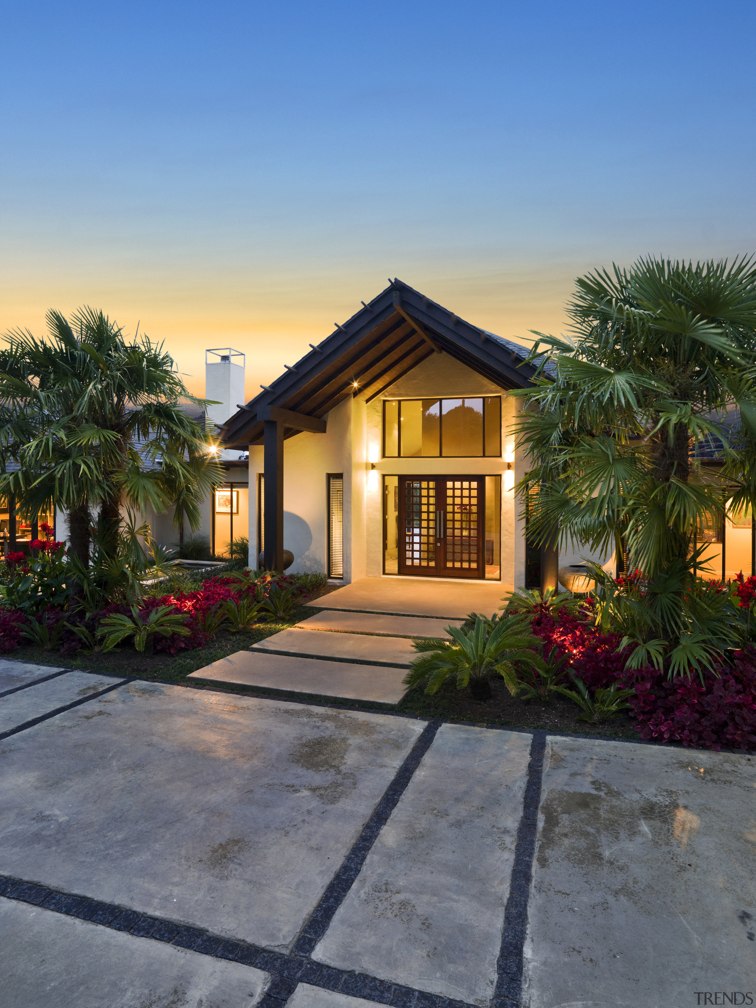 Exterior view of resort-style home designed by Masonry architecture, arecales, building, cottage, estate, facade, home, house, landscape, palm tree, property, real estate, residential area, sky, villa, window, gray