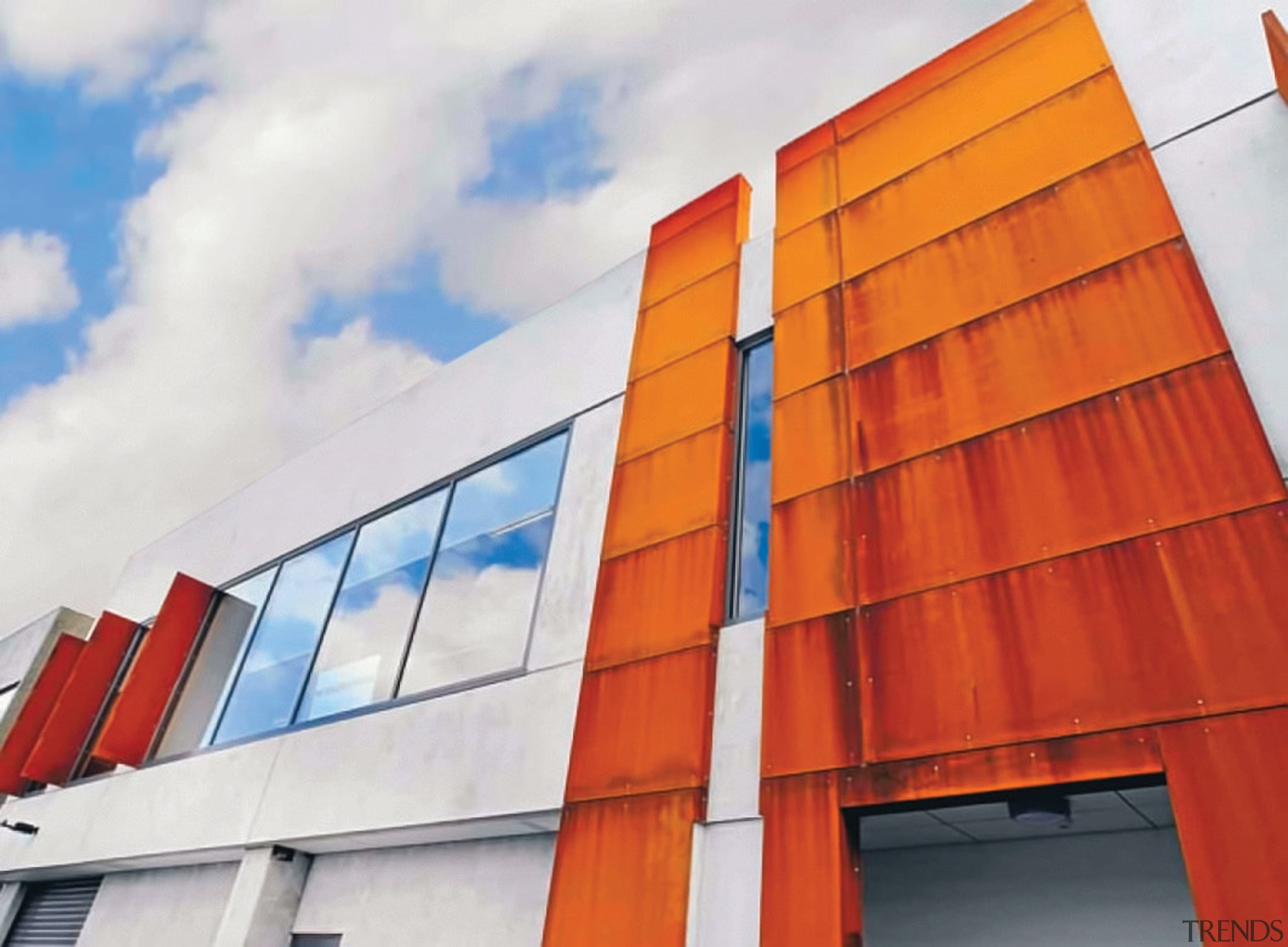 Corten steel facade on mixed use commercial development architecture, building, commercial building, corporate headquarters, daylighting, elevation, facade, line, orange, real estate, roof, sky, structure, window, white, red