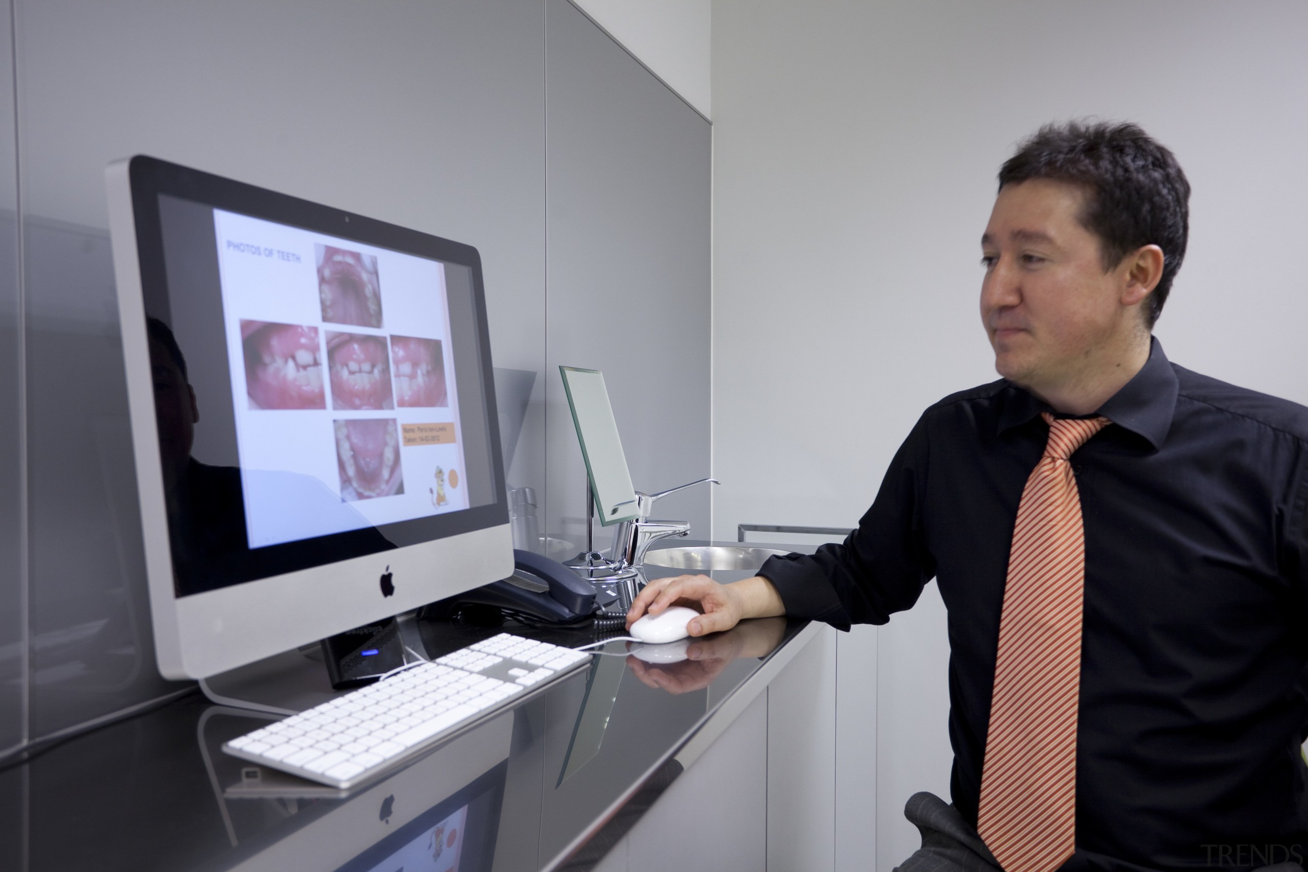 View of man demonstrating computer system. - View computer professional, display device, electronic device, product design, technology, gray, black