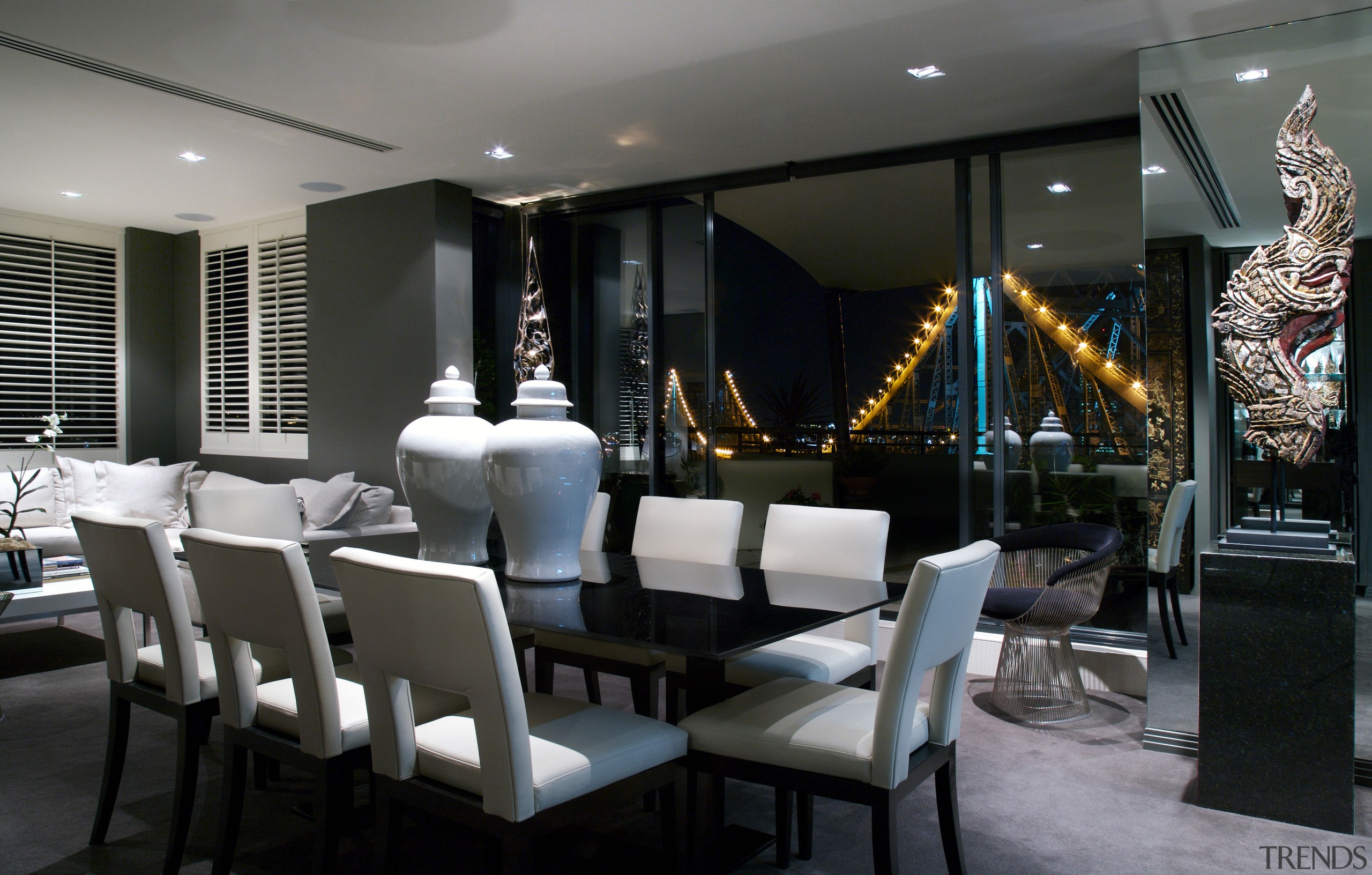 Walls in this contemporary New Farm penthouse are dining room, interior design, restaurant, black, gray