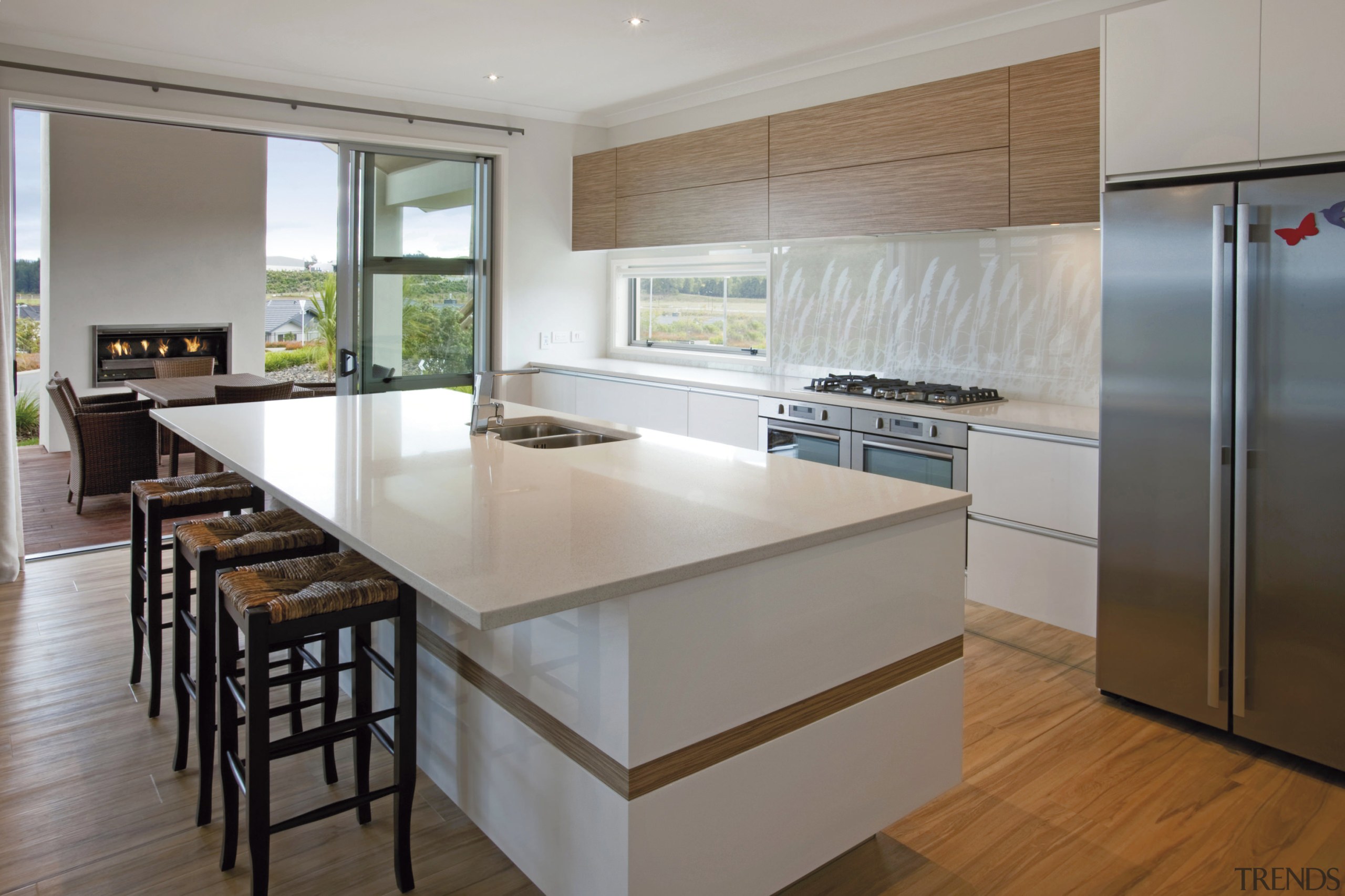 All the laid back charm of the picturesque countertop, floor, flooring, hardwood, interior design, kitchen, real estate, room, gray