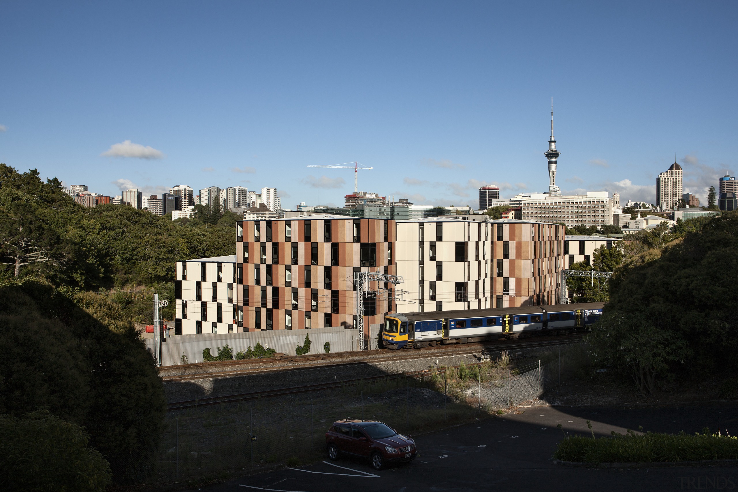 Carlaw Park Student Village in Auckland accommodates students architecture, building, city, daytime, estate, facade, house, landmark, metropolis, metropolitan area, neighbourhood, plant, real estate, residential area, roof, sky, skyline, suburb, tower block, town, tree, urban area, black, teal