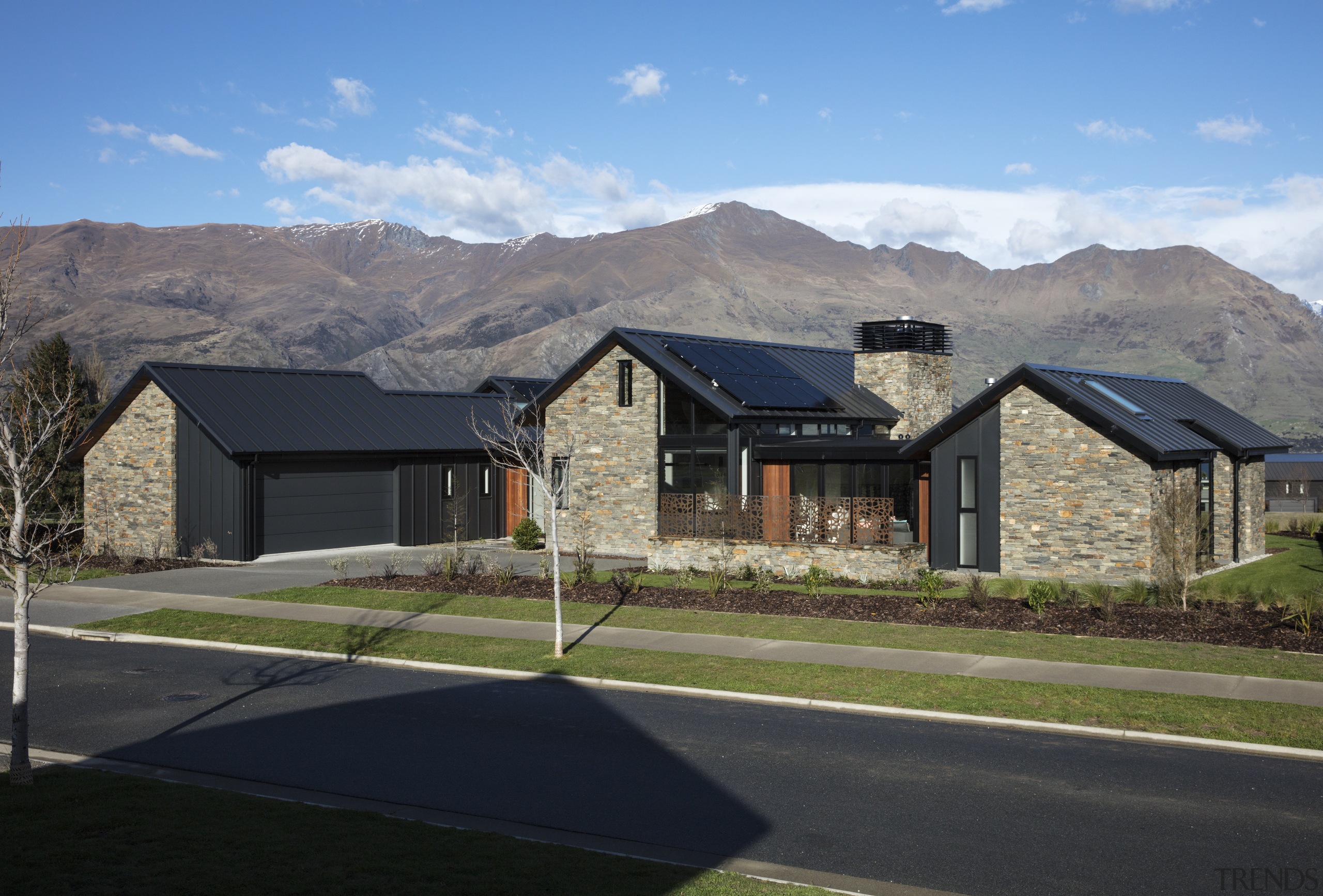 ​​​​​​​The far pavilion – the guest wing of architecture, home, house, landscape, mountain, ridge, roof, rural area, schist, stone, Condon Scott