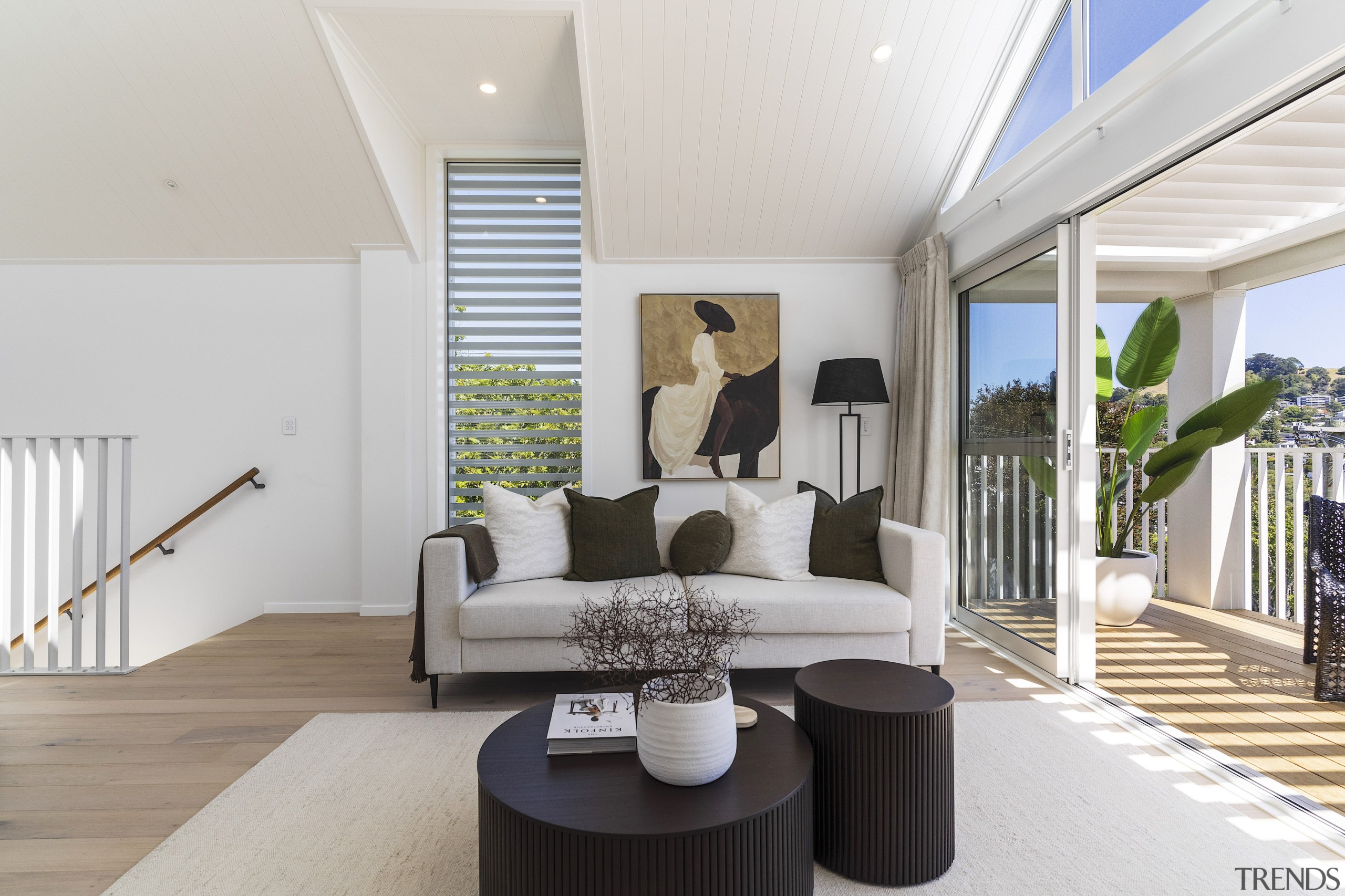 Upstairs living space boasting relaxed indoor-outdoor flow. 