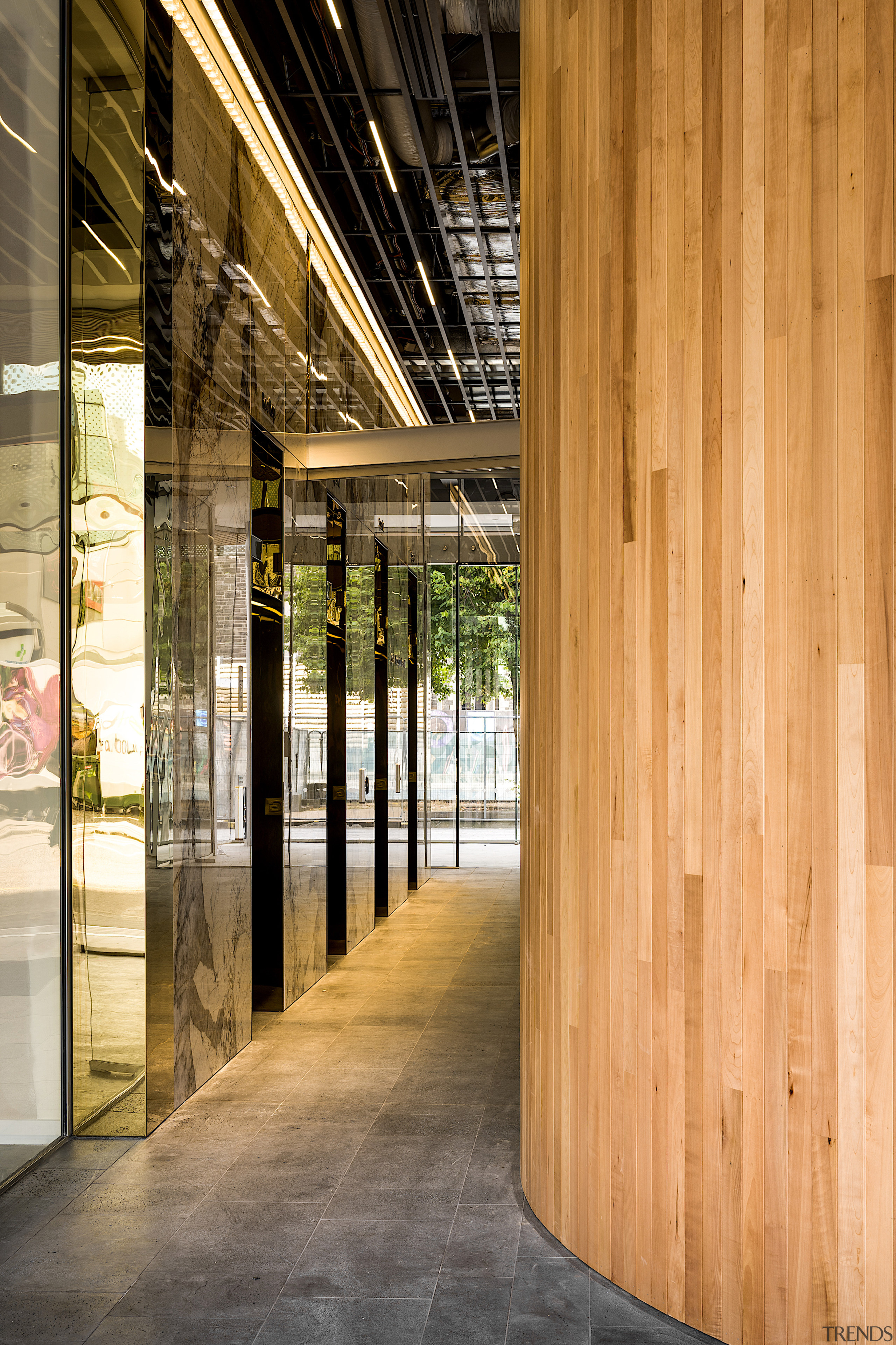 Gold aluminium lift doors and granite lobby face 