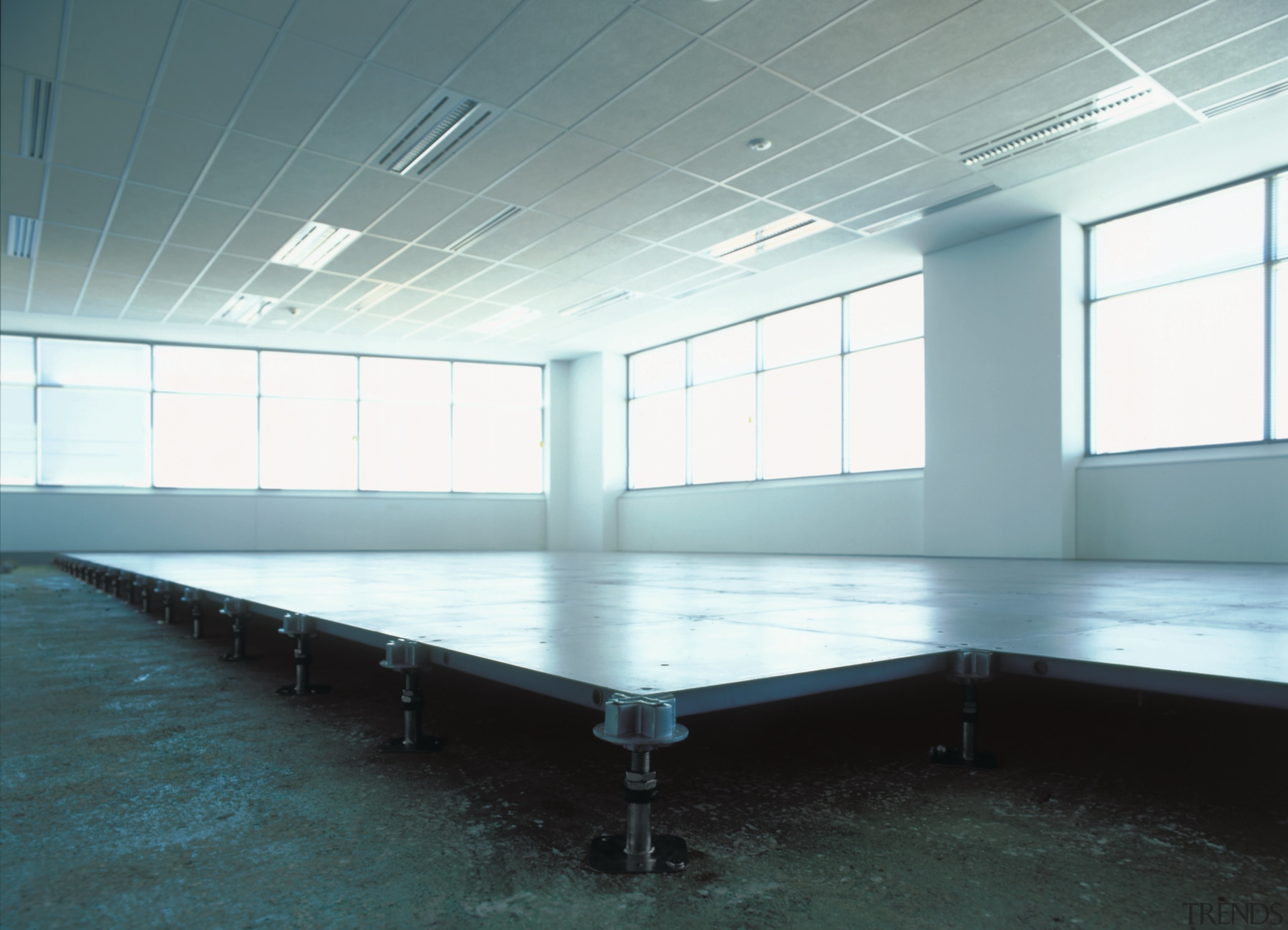 view of the raised access flooring - view ceiling, daylighting, floor, flooring, glass, leisure centre, light, lighting, structure, table, white