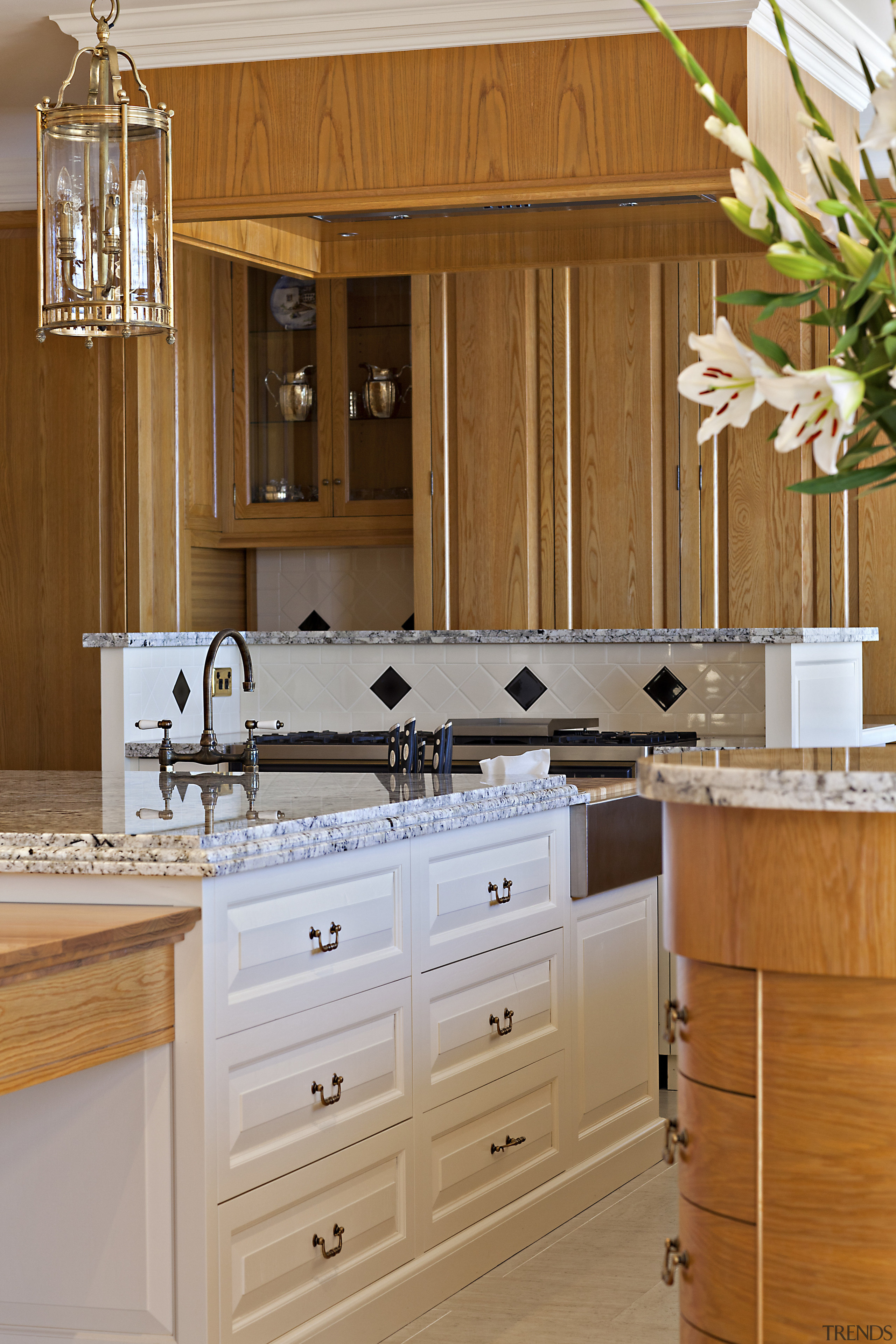 A close up view of the kitchen cabinetry. bathroom, bathroom accessory, bathroom cabinet, cabinetry, countertop, cuisine classique, home, interior design, kitchen, room, sink, wood stain, brown, gray