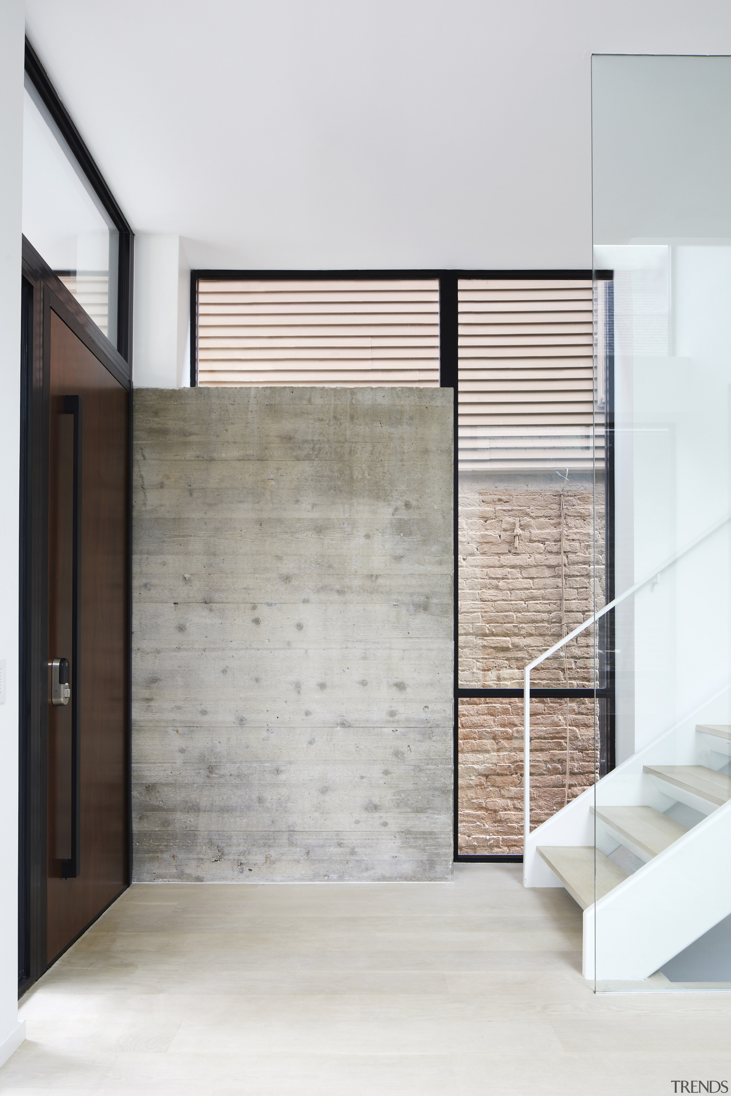 Exposed shuttered concrete anchors the space and provides 