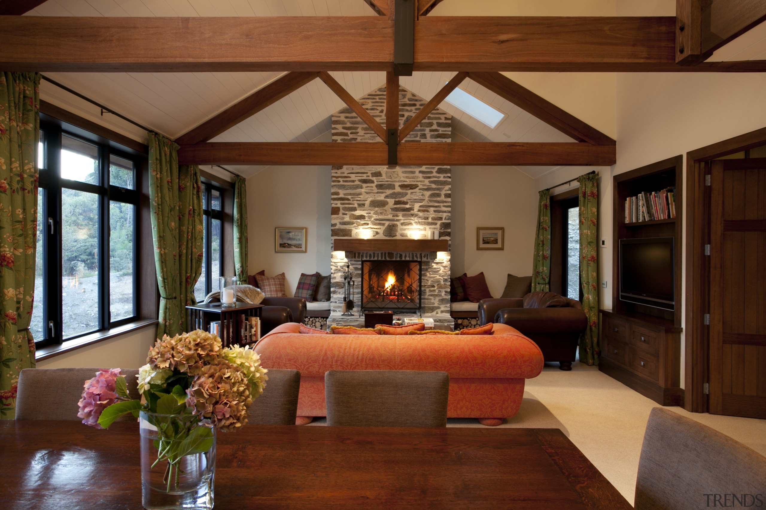 View of dining and lounge area with wooden beam, ceiling, flooring, hardwood, home, interior design, living room, real estate, room, wood, wood flooring, brown, red