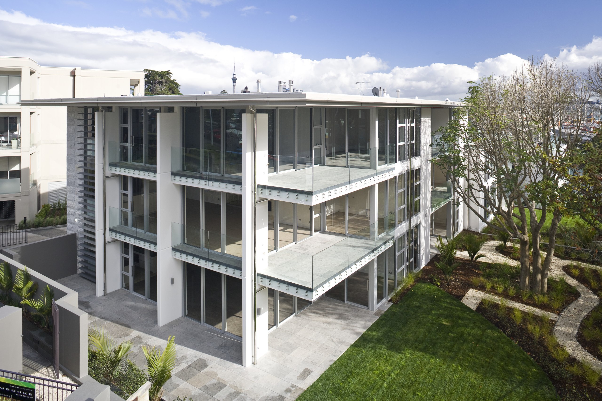 Exterior view of a Parnell apartment complex which apartment, architecture, building, condominium, corporate headquarters, elevation, estate, facade, home, house, mixed use, official residence, property, real estate, residential area, villa, white