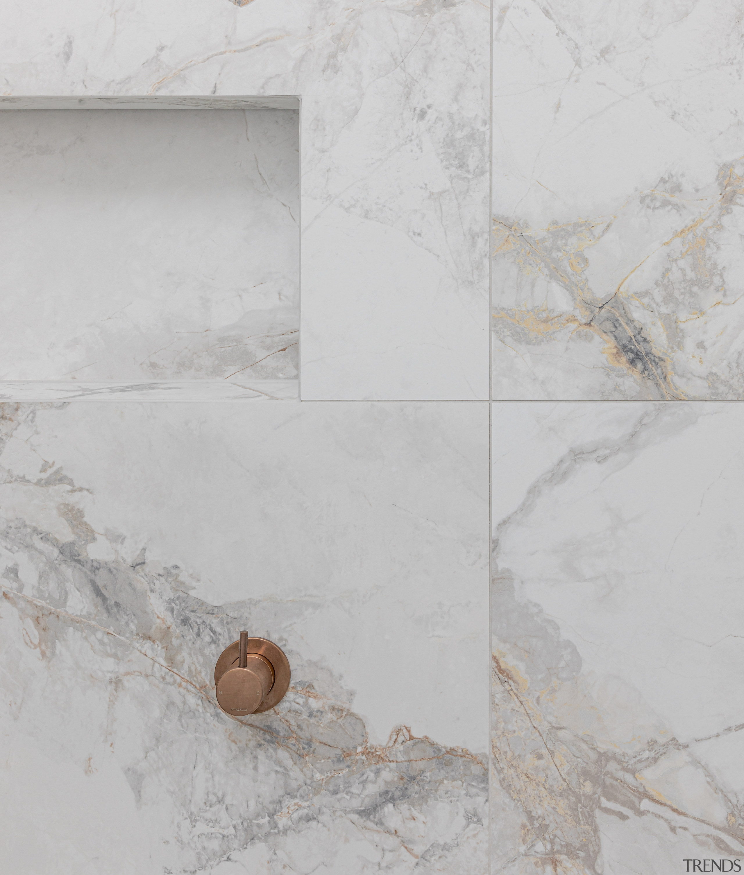 The stone's rich veining connects with the accessories' 